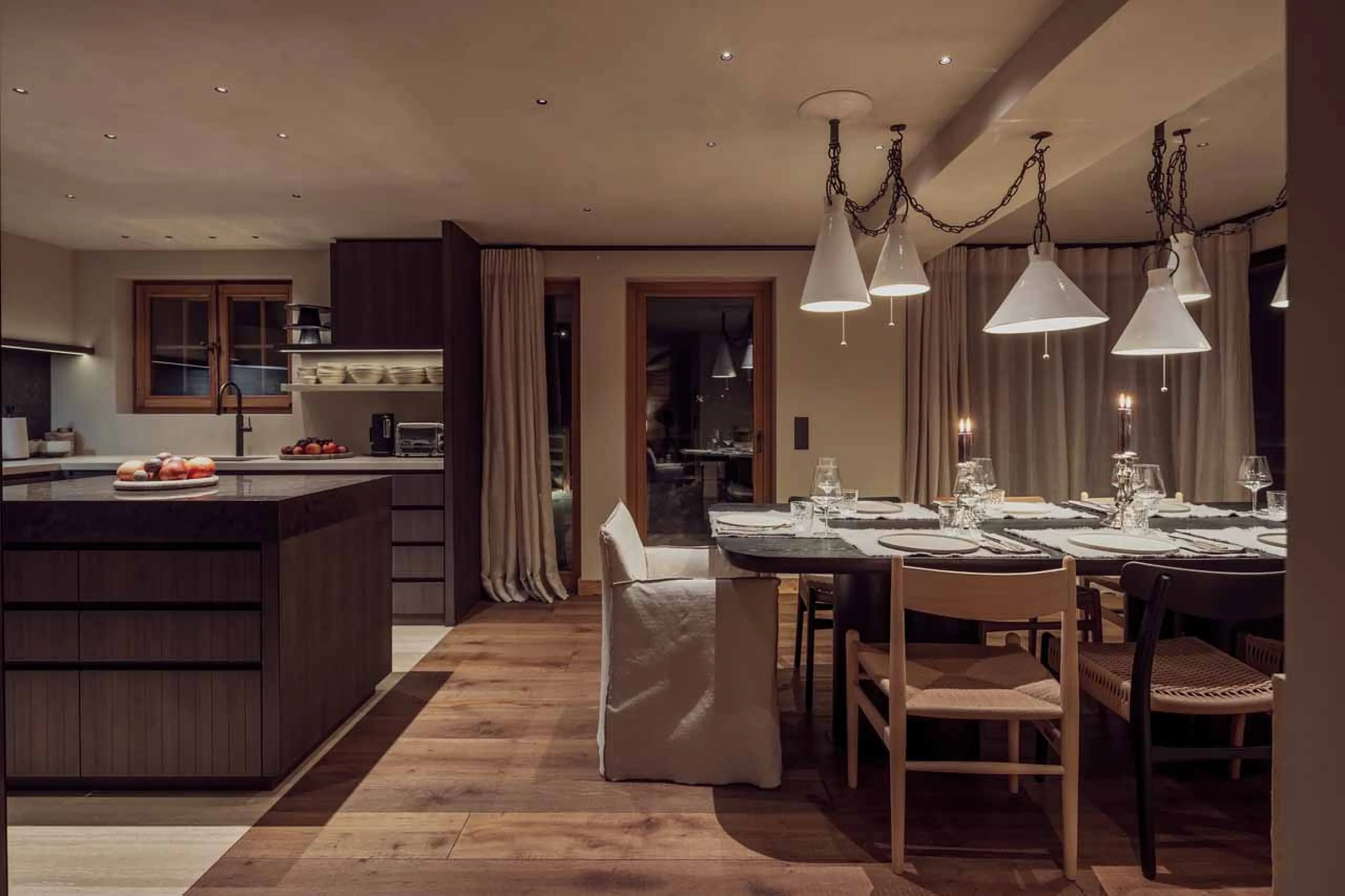 Dining table and kitchen at Vallon D'Arbi in Verbier
