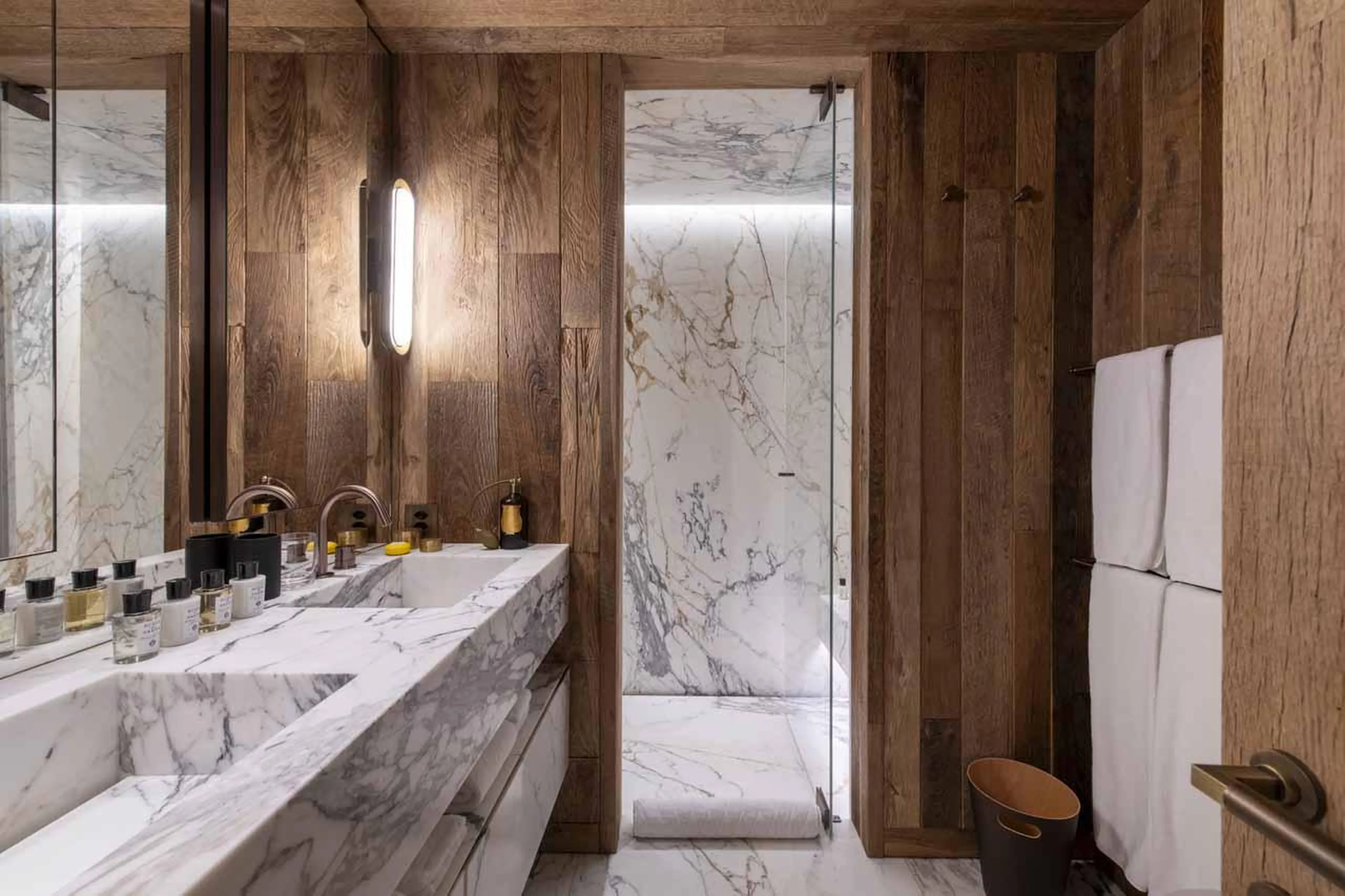 En-suite shower room with double basin at Chalet Vicuna in Verbier
