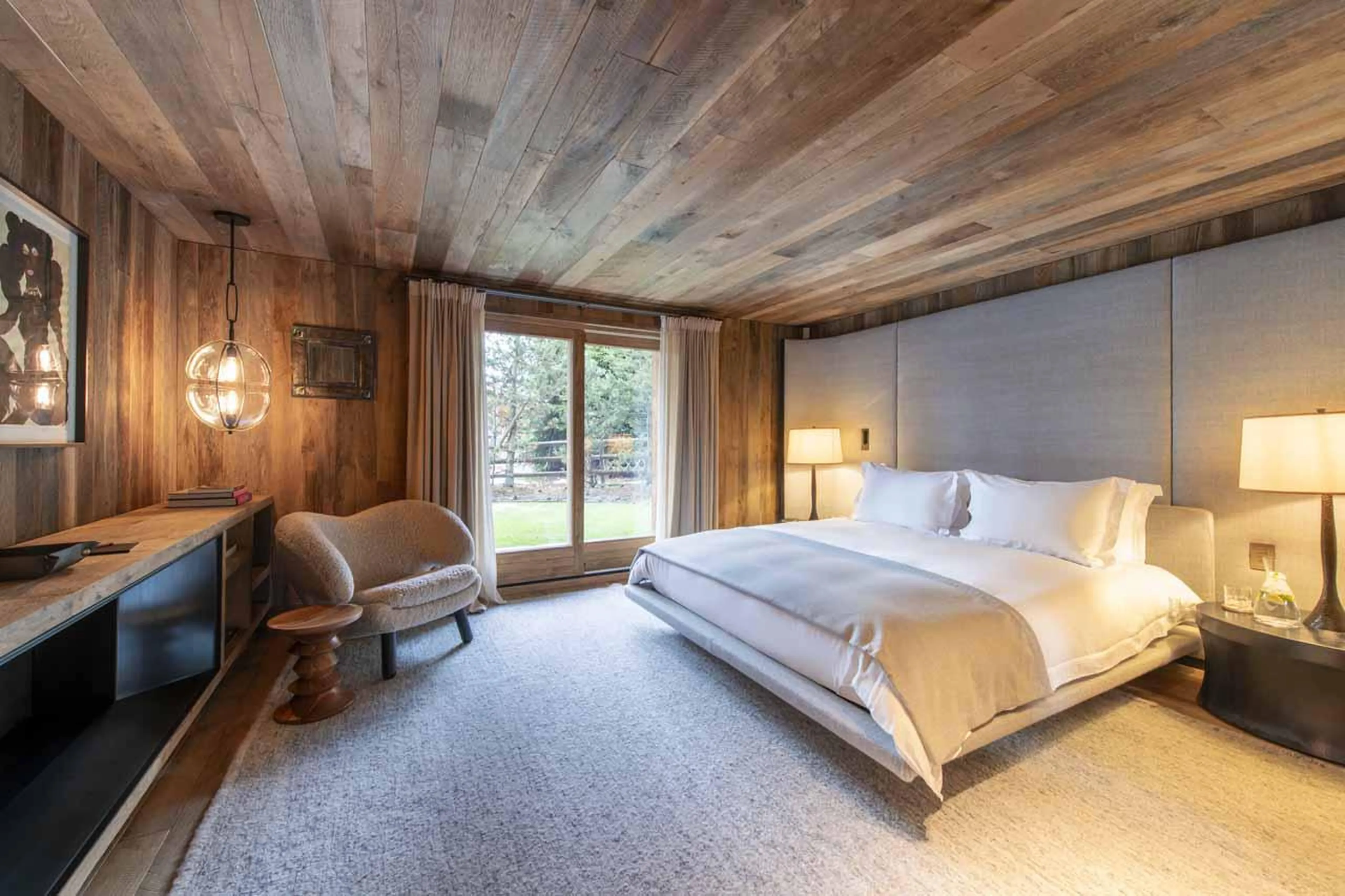 Double bedroom with terrace access and en-suite shower room at Chalet Vicuna in Verbier