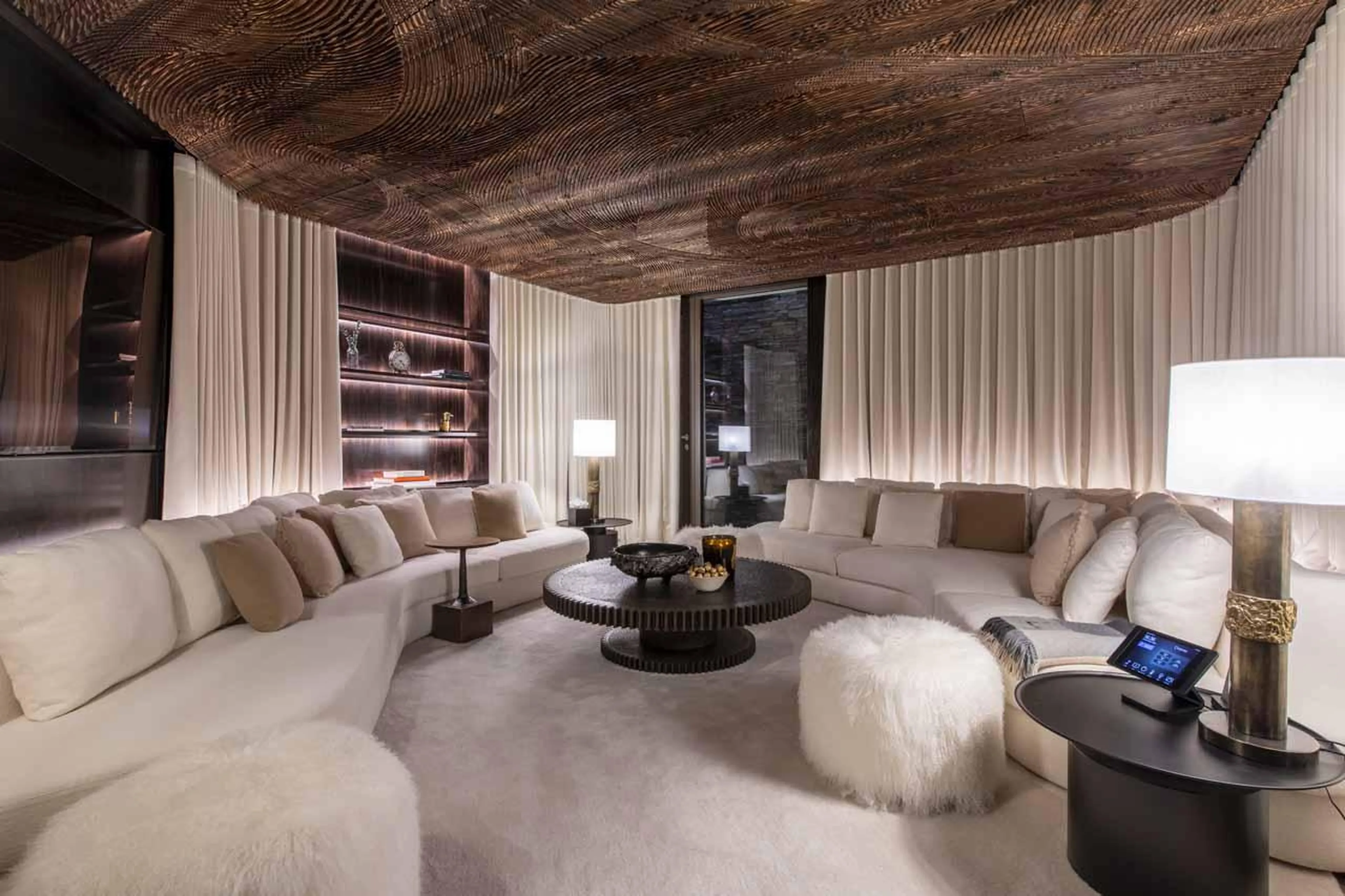 Cinema room with warp-around sofas at Chalet Vicuna in Verbier