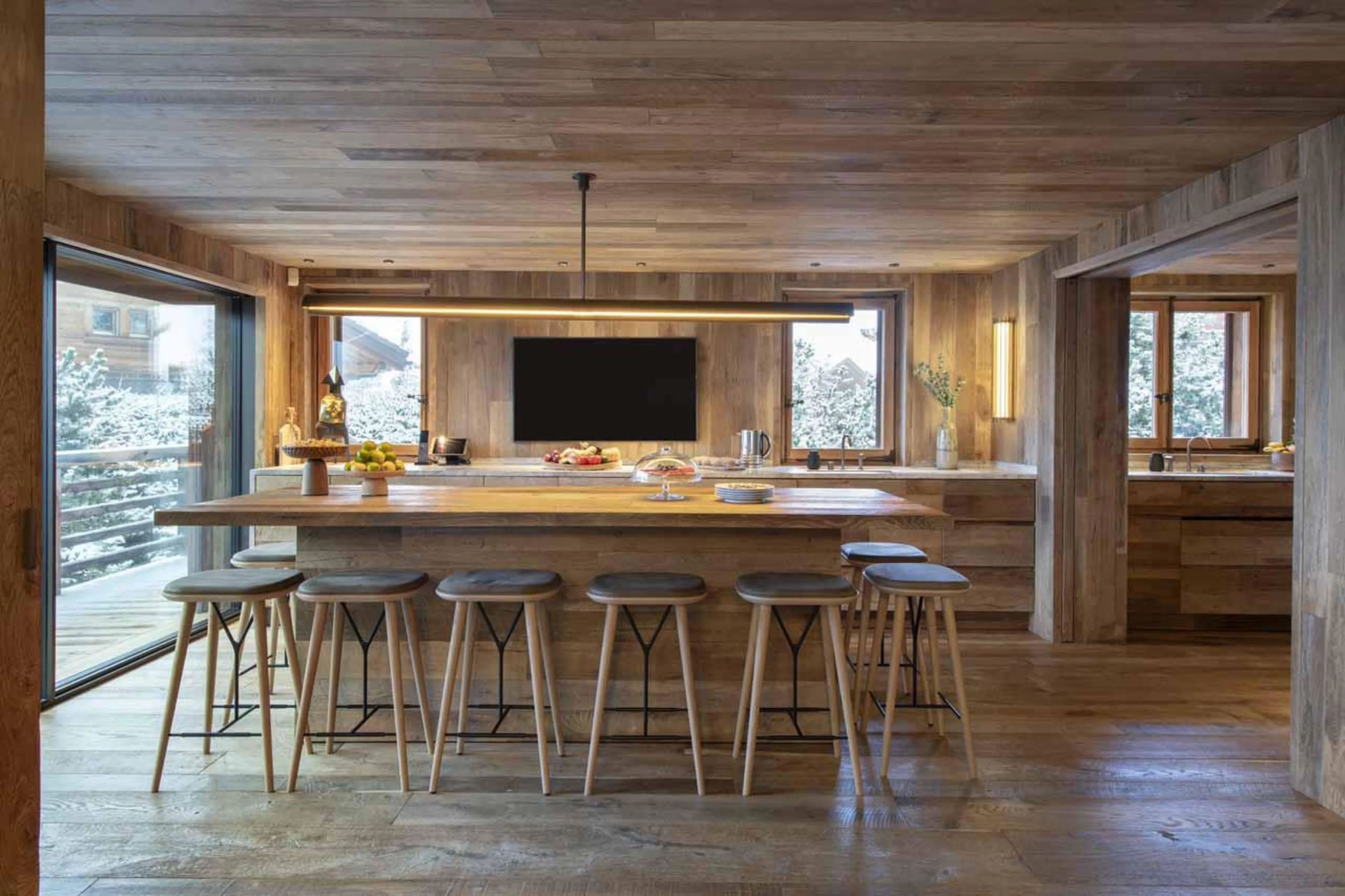 Large kitchen island with space to seat eight at Chalet Vicuna in Verbier