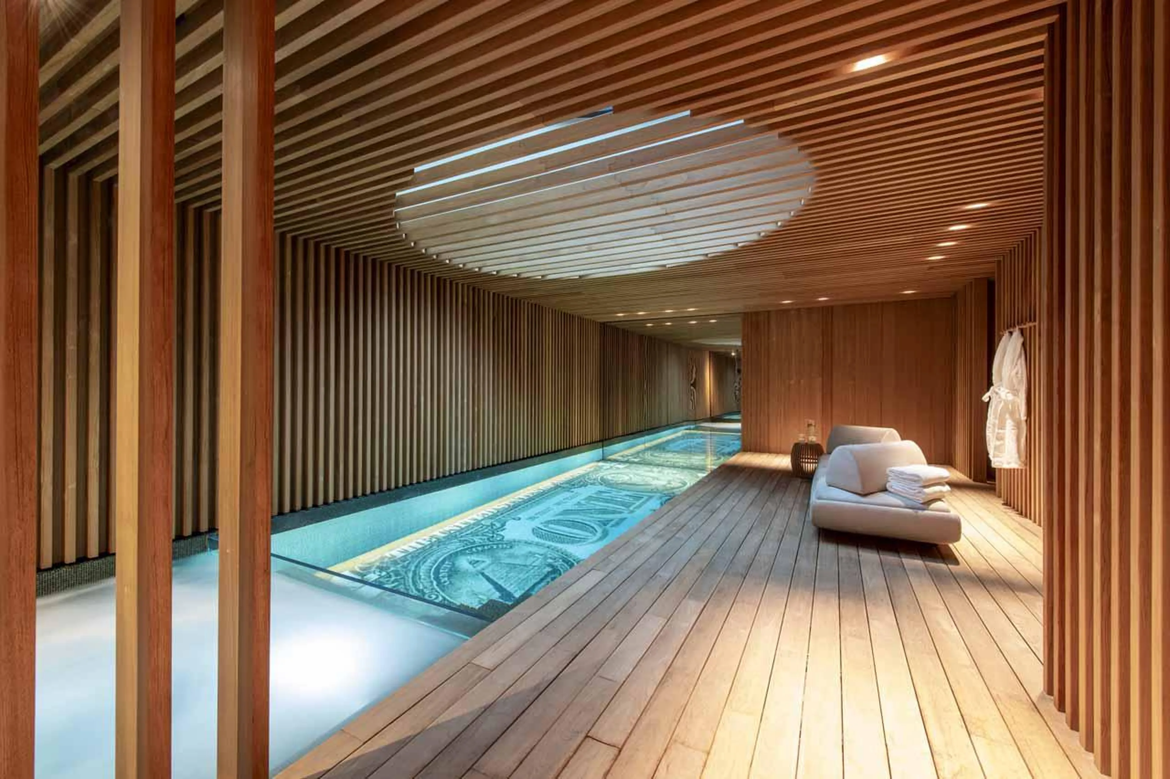 Indoor swimming pool with integrated hot tub at Chalet Vicuna in Verbier