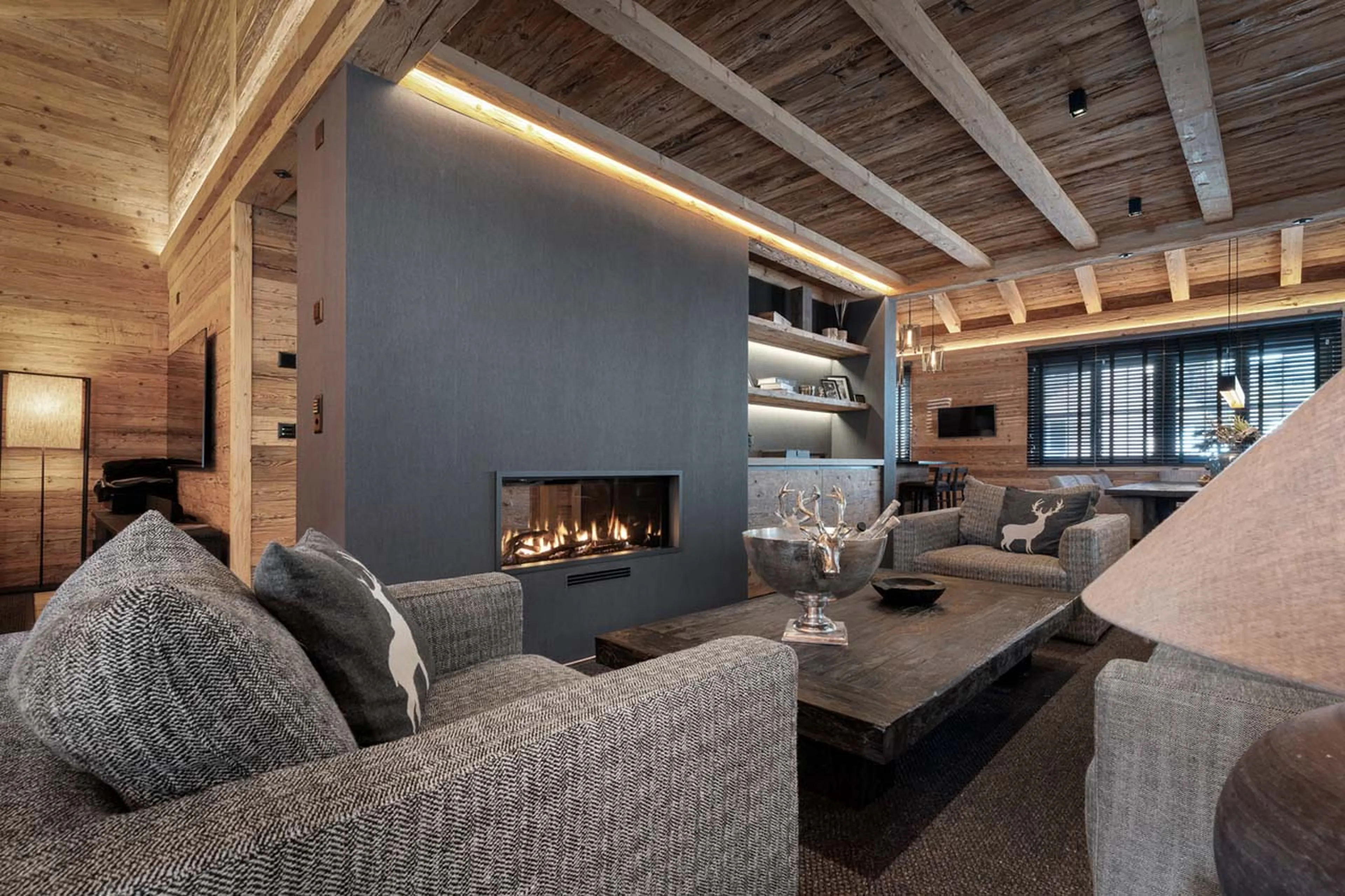 Sitting room with fireplace in Chalet Wood, Davos