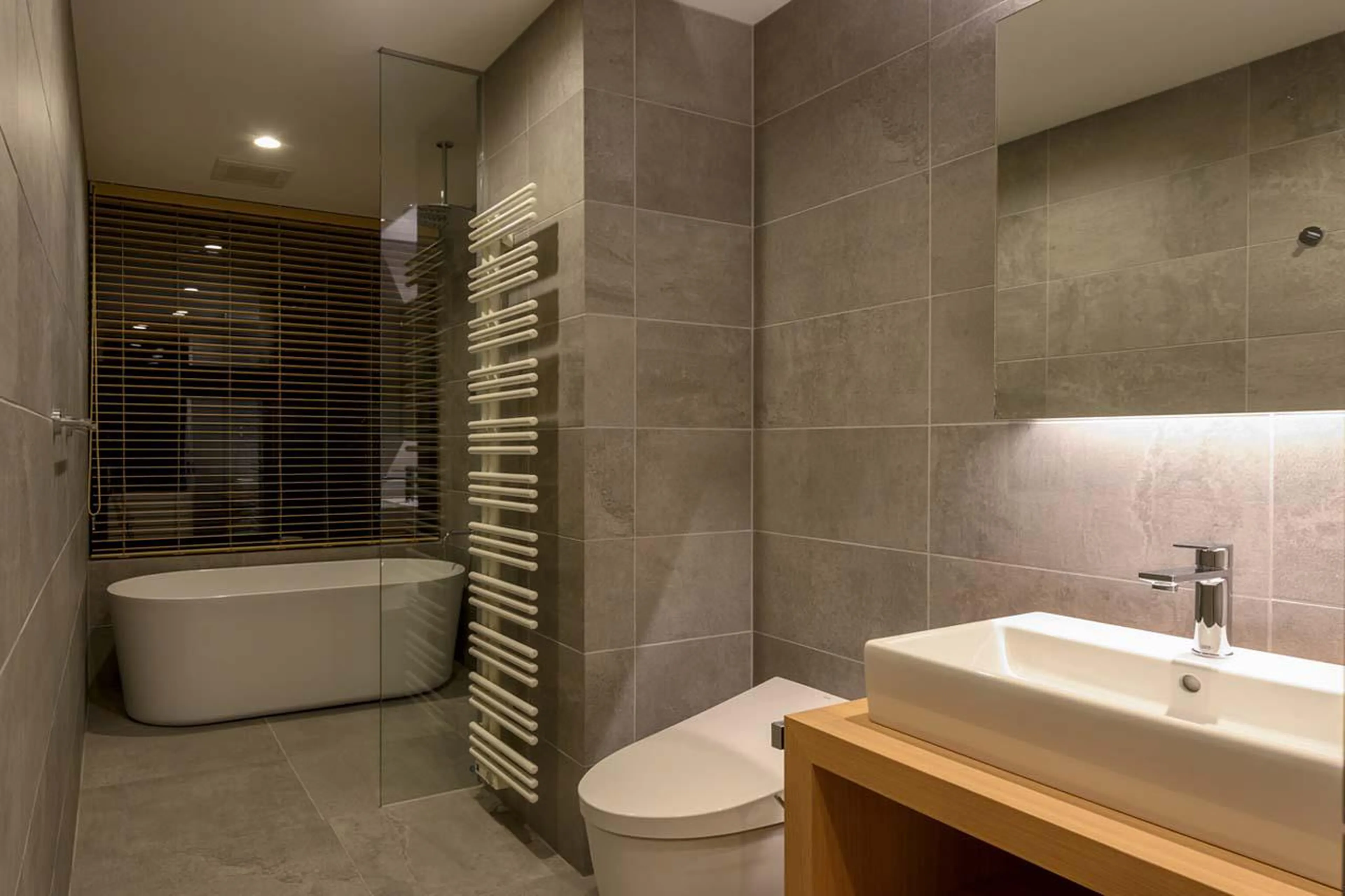 En-suite bathroom with bath at Chalet Yukihyo in Niseko