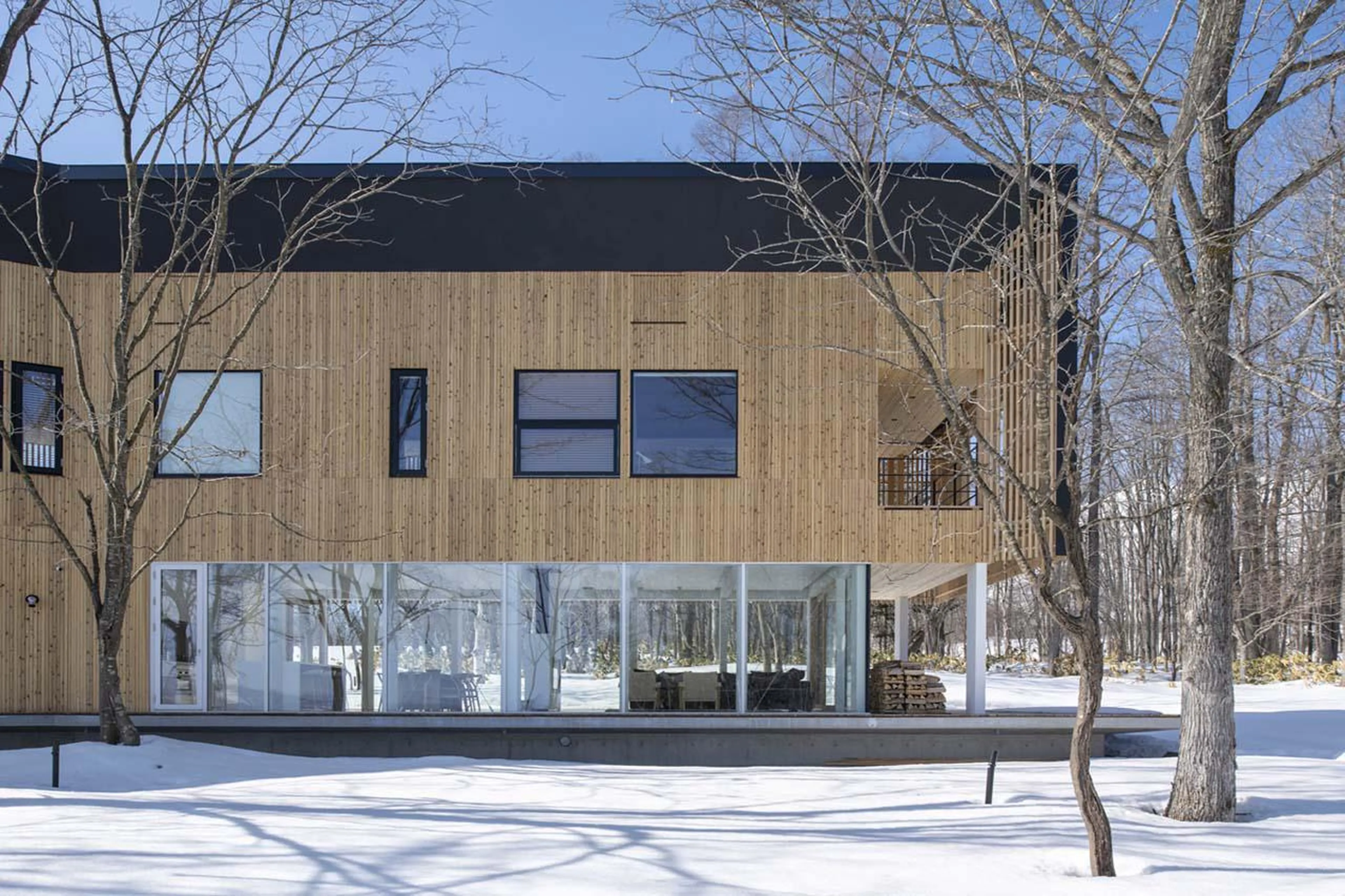 Wooden and glass exterior at Chalet Yukihyo in Niseko
