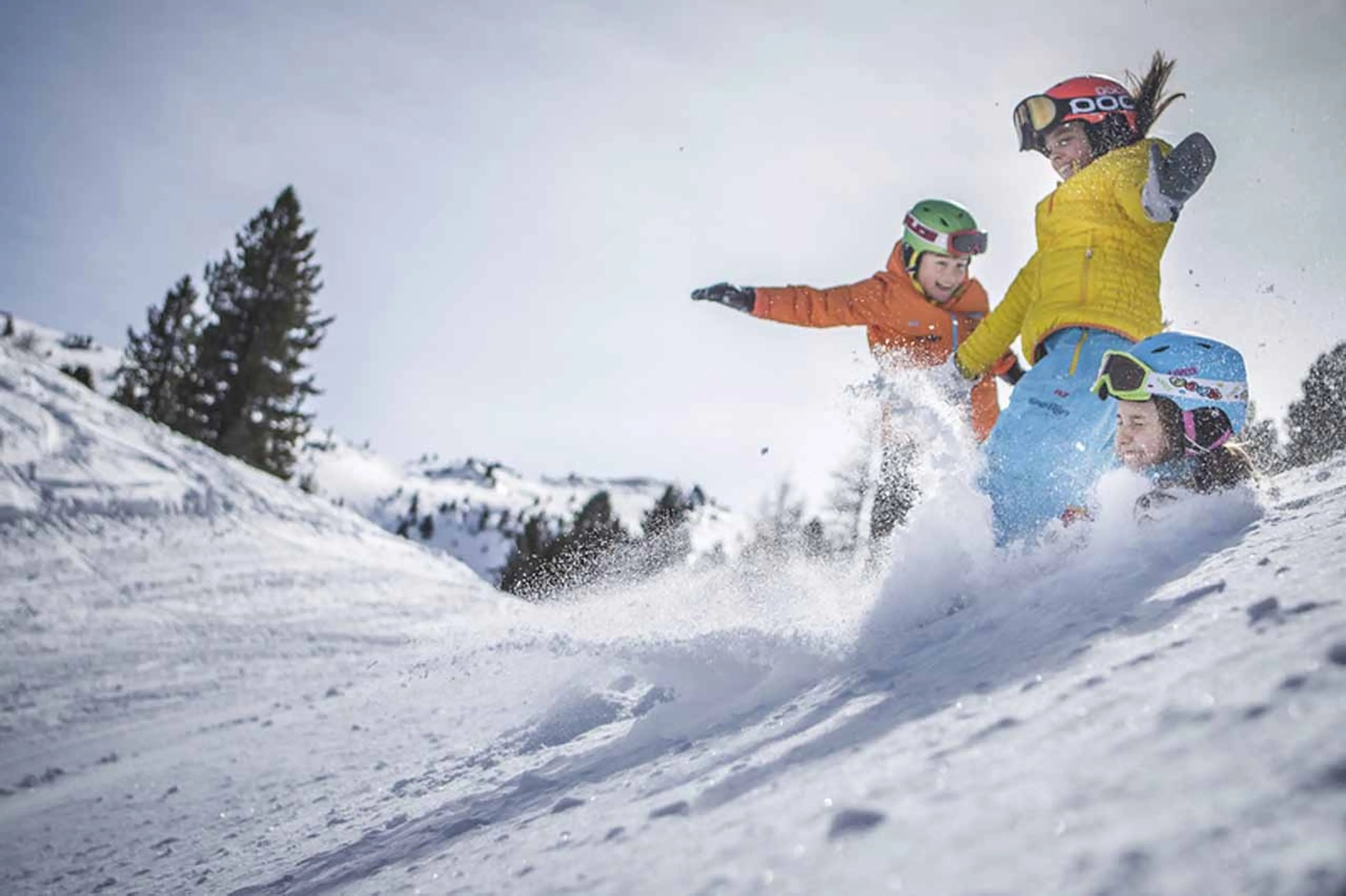 Children laughing and playing in the snow