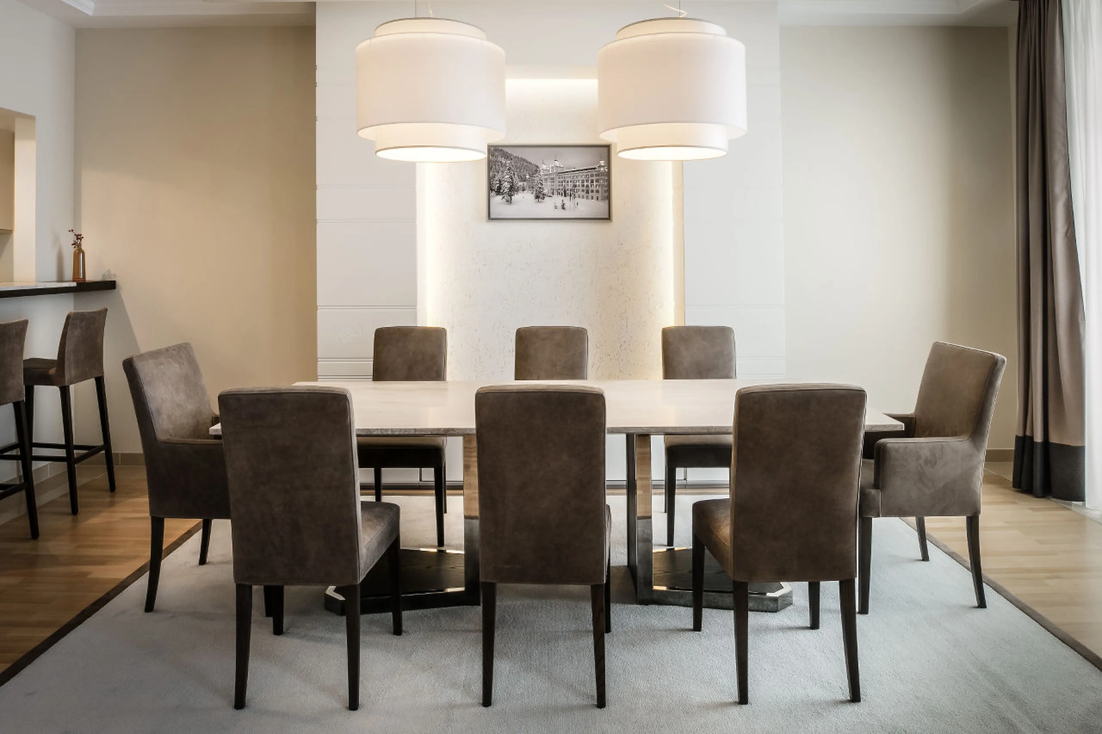 Dining table and kitchen at Corviglia Tower in St Moritz