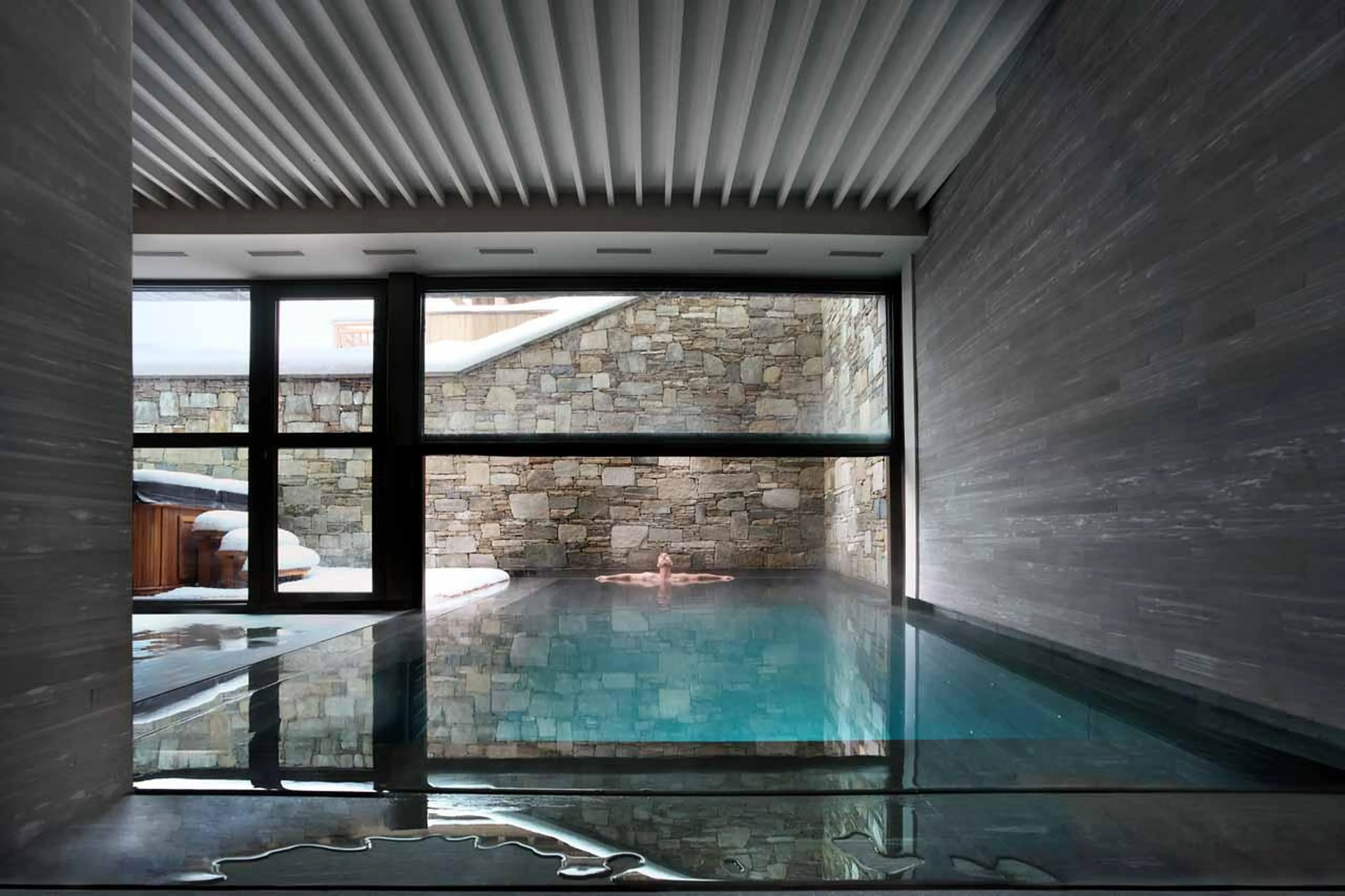 Swimming in indoor-outdoor pool at Etoile du Nord East Wing in Val d'Isere