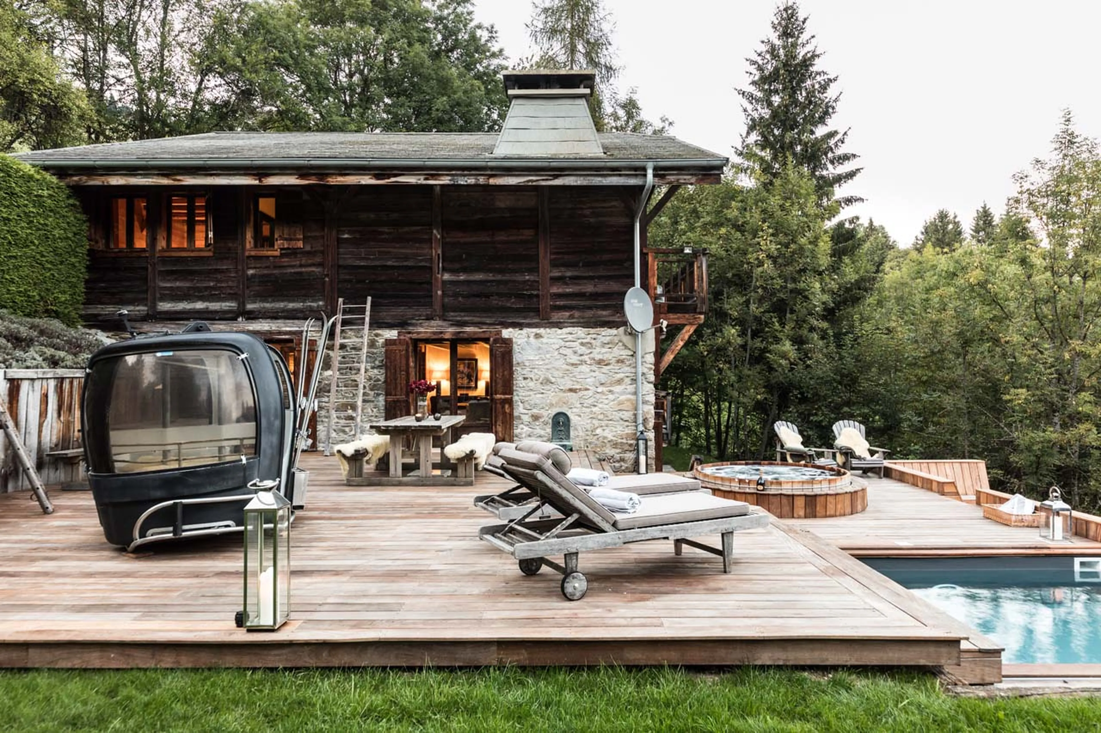 Terrace with ski gondola and hot tub at Ferme de Moudon in Les Gets
