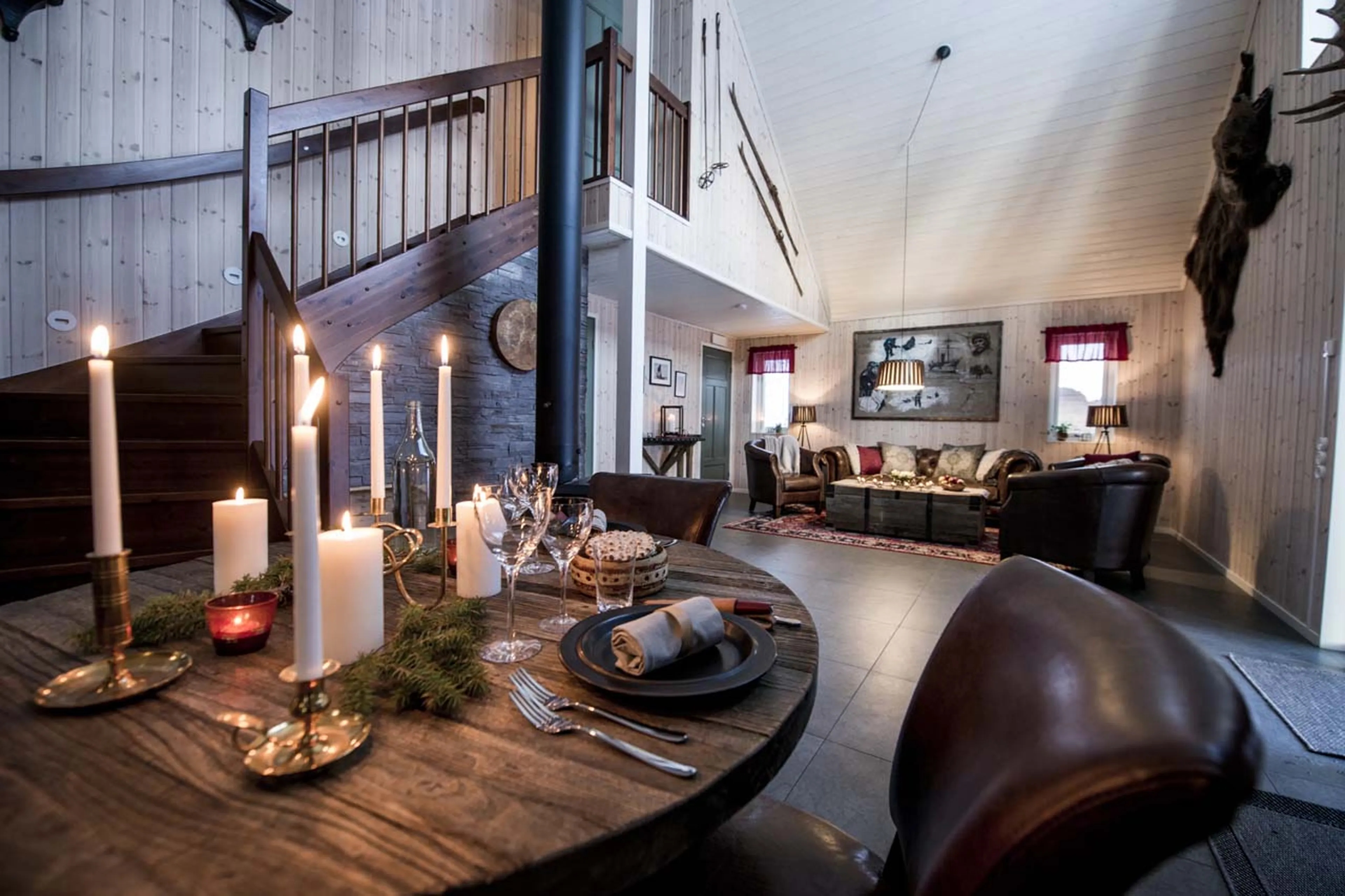 Open plan living & dining area at Fjellborg Arctic Lodge in Sweden