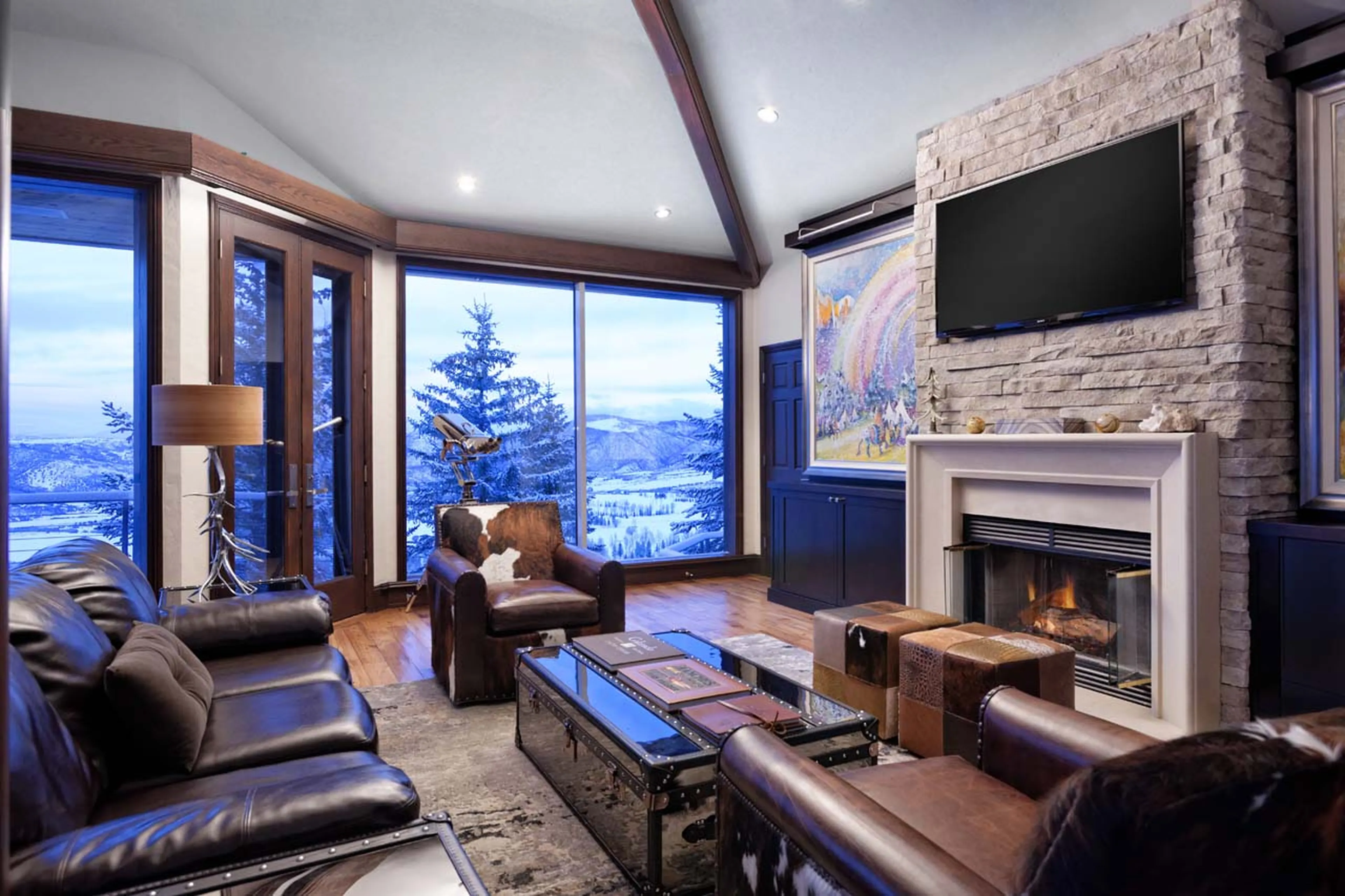 TV & fireplace in living area of Four Peaks Estate in Aspen