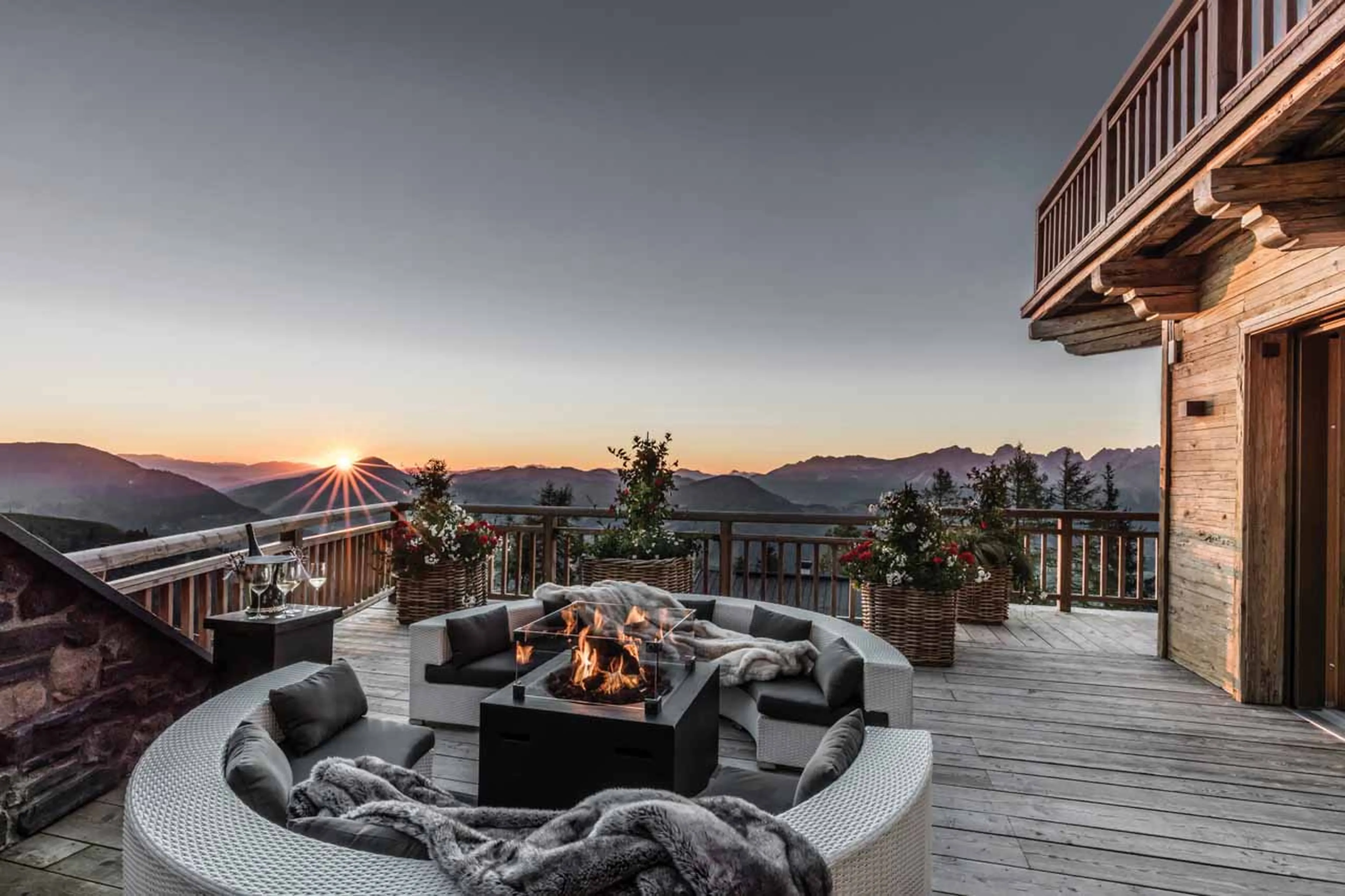 Terrace with fire pit at Hahnenkamm Lodge in Kitzbuhel