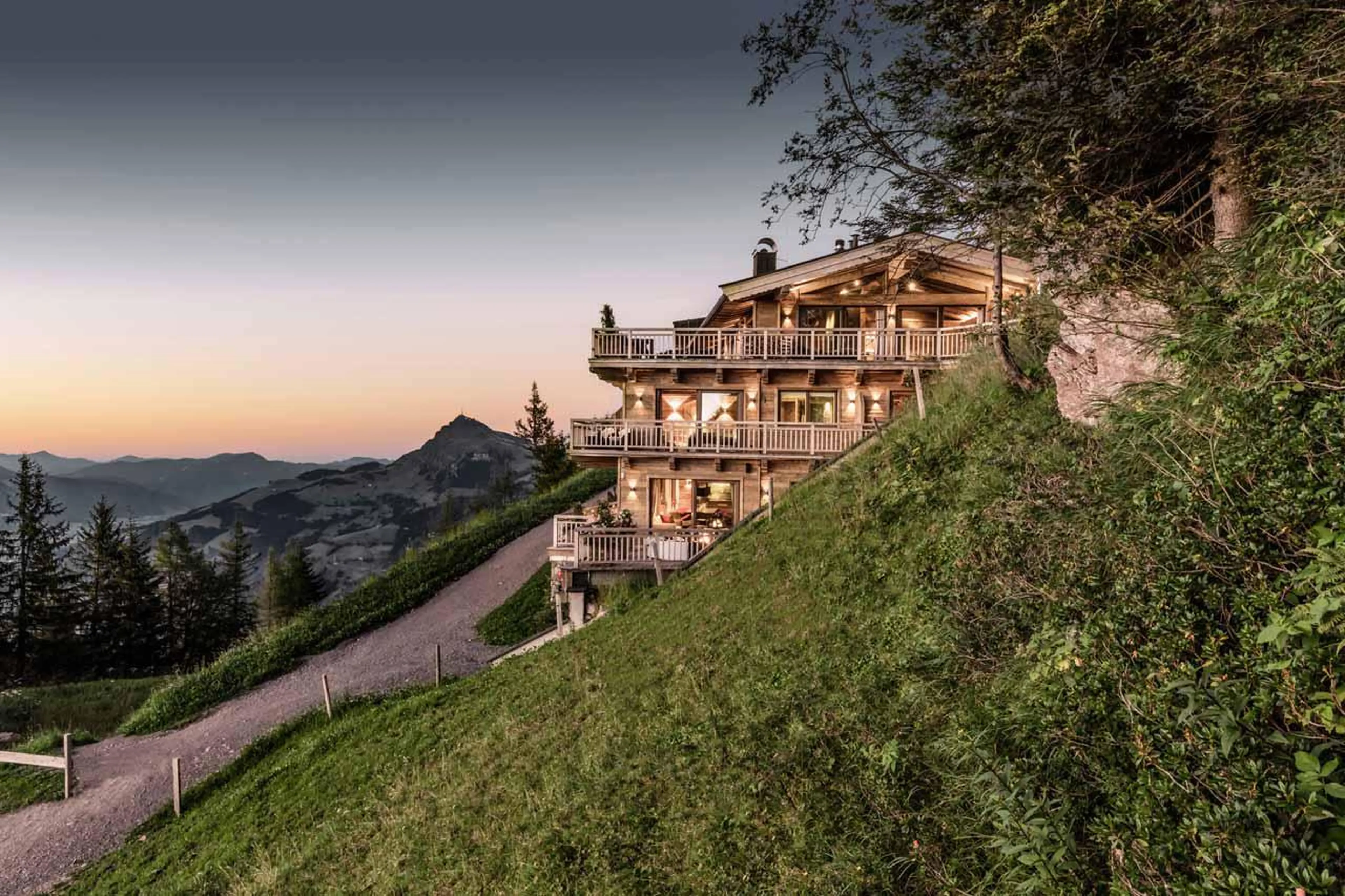 Exterior of Hahnenkamm Lodge in Kitzbuhel in summer