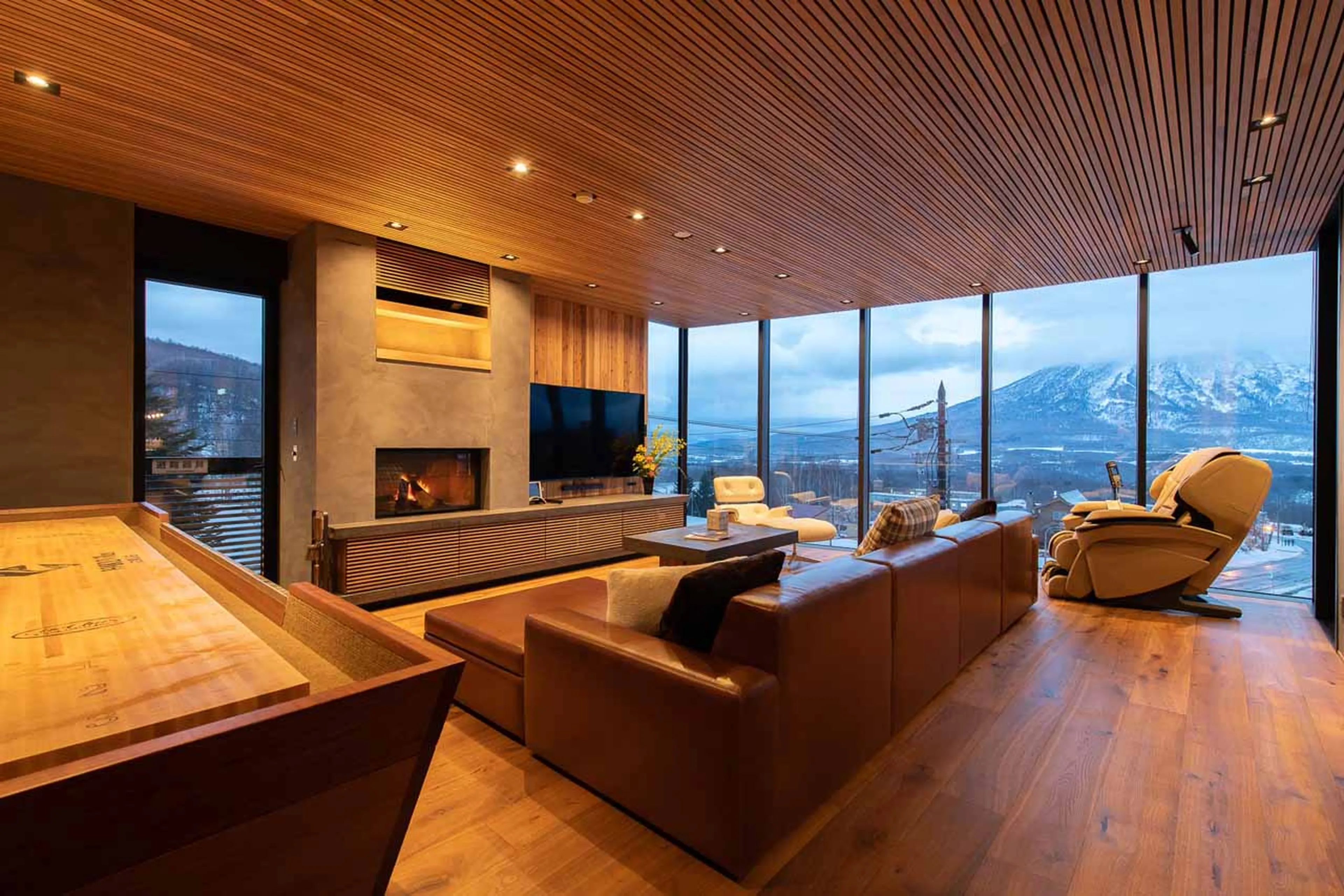 Living area of HakuVillas in Niseko at night