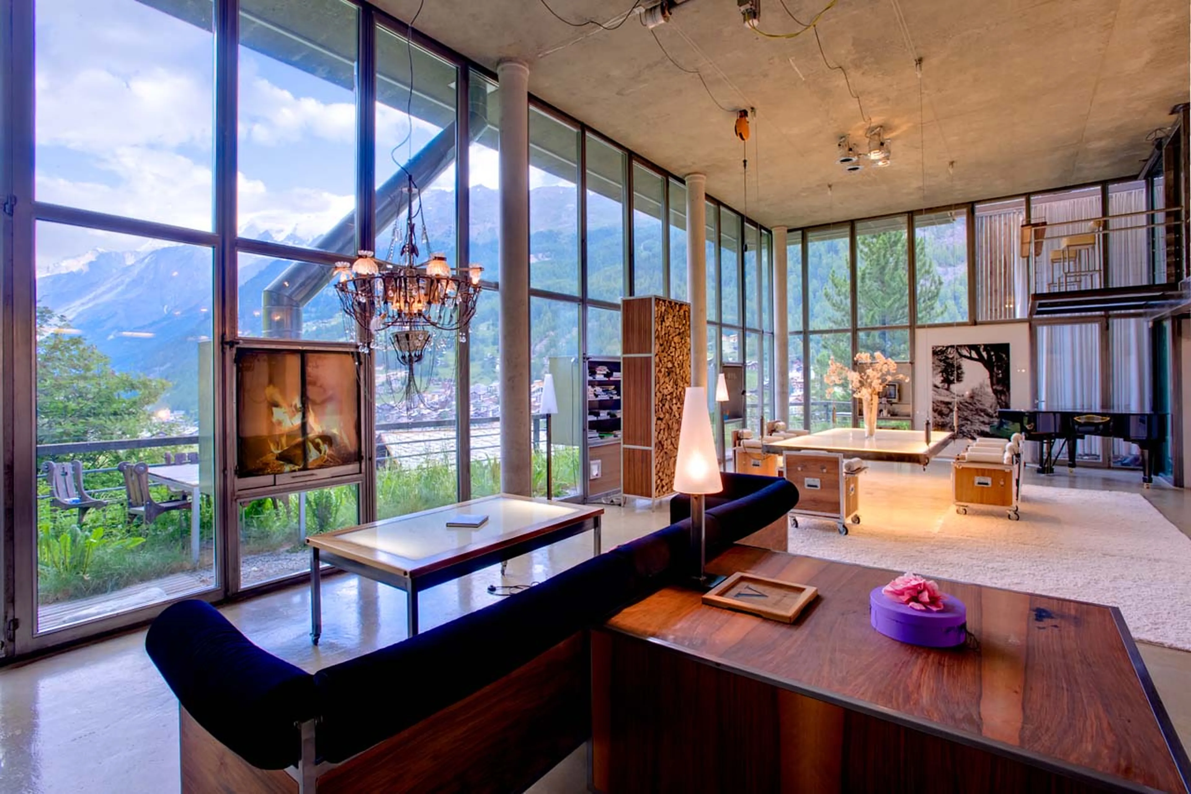 Fireplace set into wall in Heinz Julen Loft in Zermatt