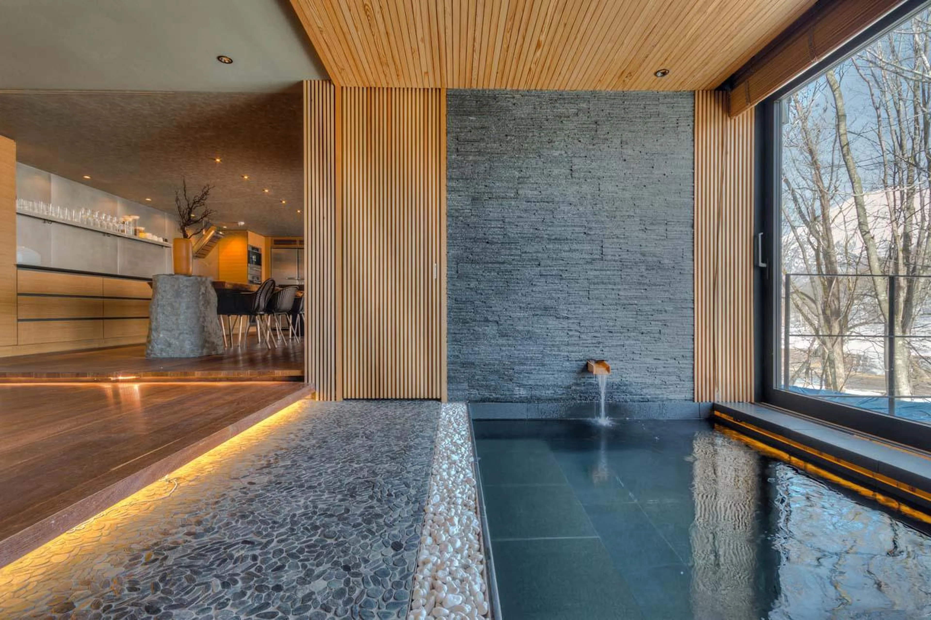 Jacuzzi within the open-plan living space at Hideaway on Escarpment in Niseko