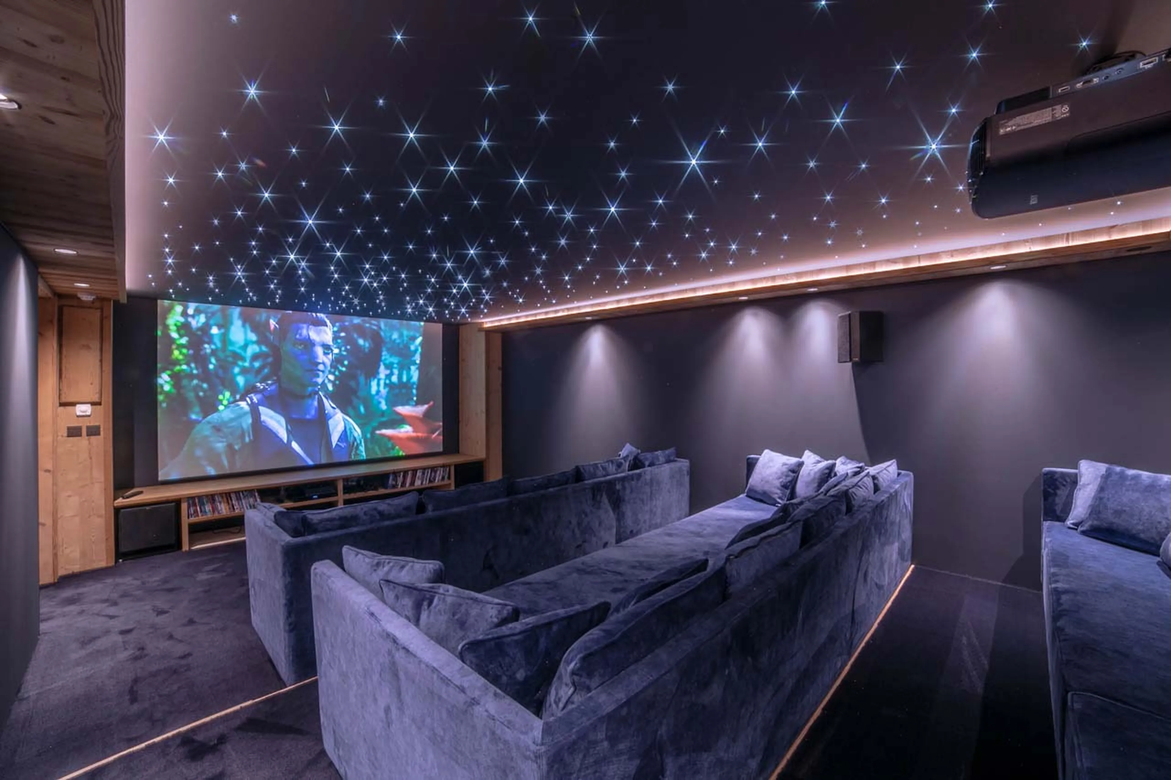 Big screen in cinema room at La Ferme de Mon Grand Pere in Meribel