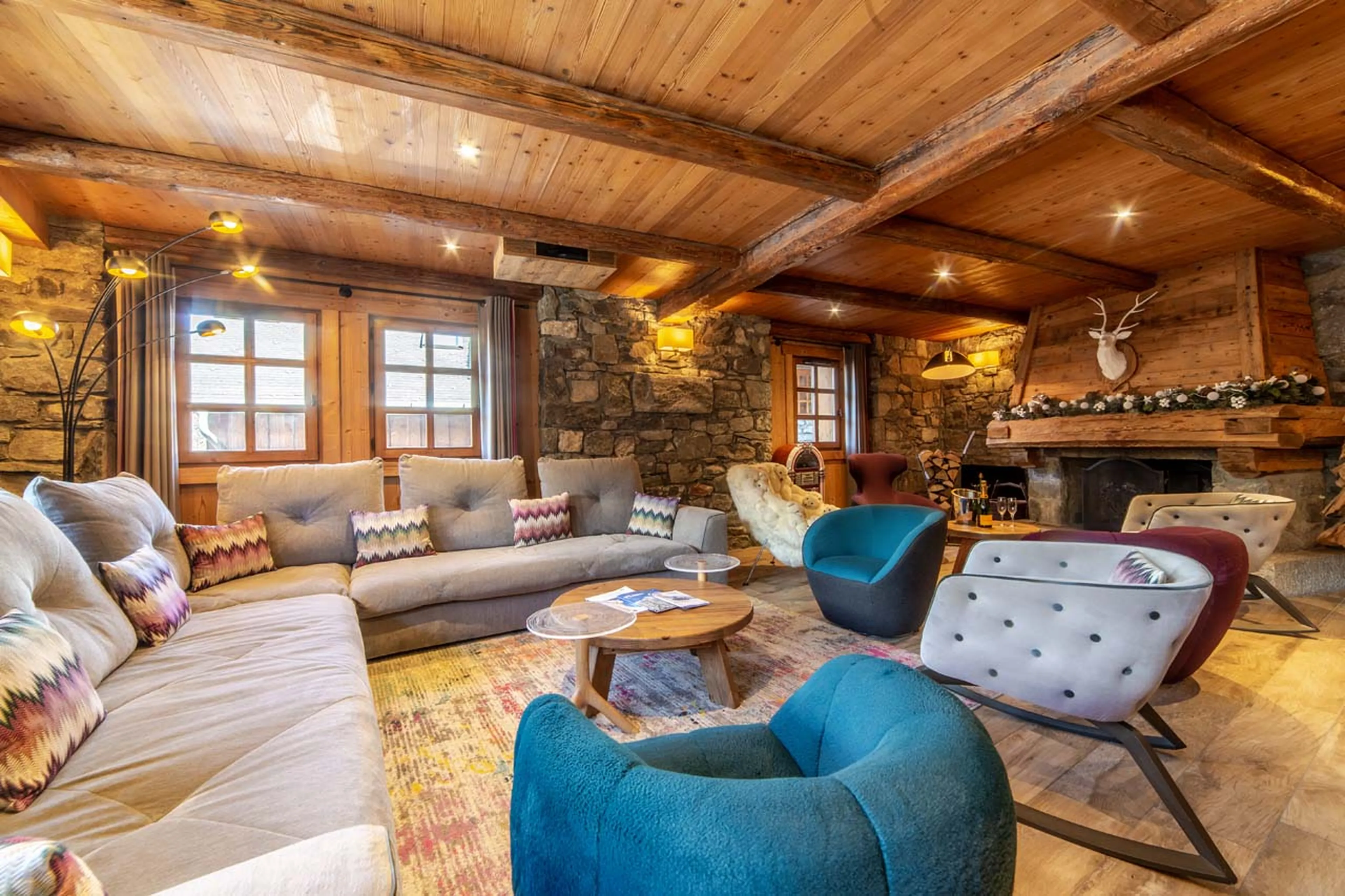 Open fireplace in living area of La Ferme de Mon Grand Pere in Meribel