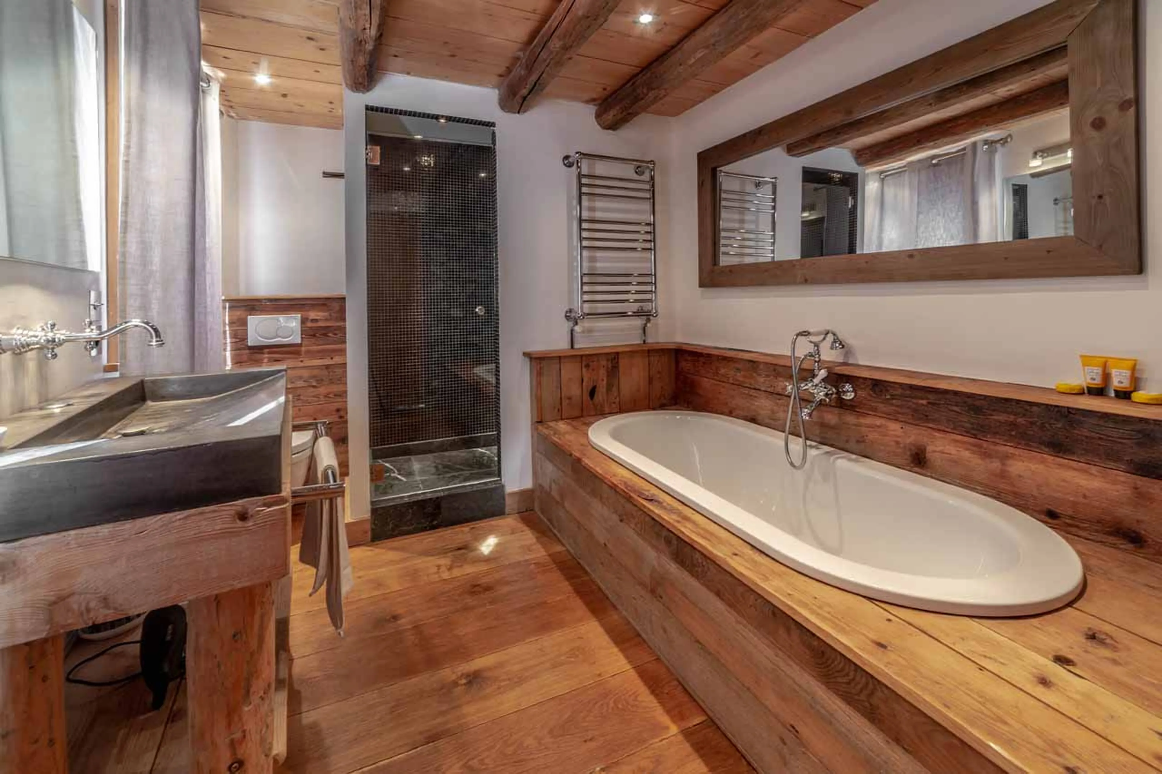 En-suite bathroom with shower at Chalet La Grange de Meribel in Meribel