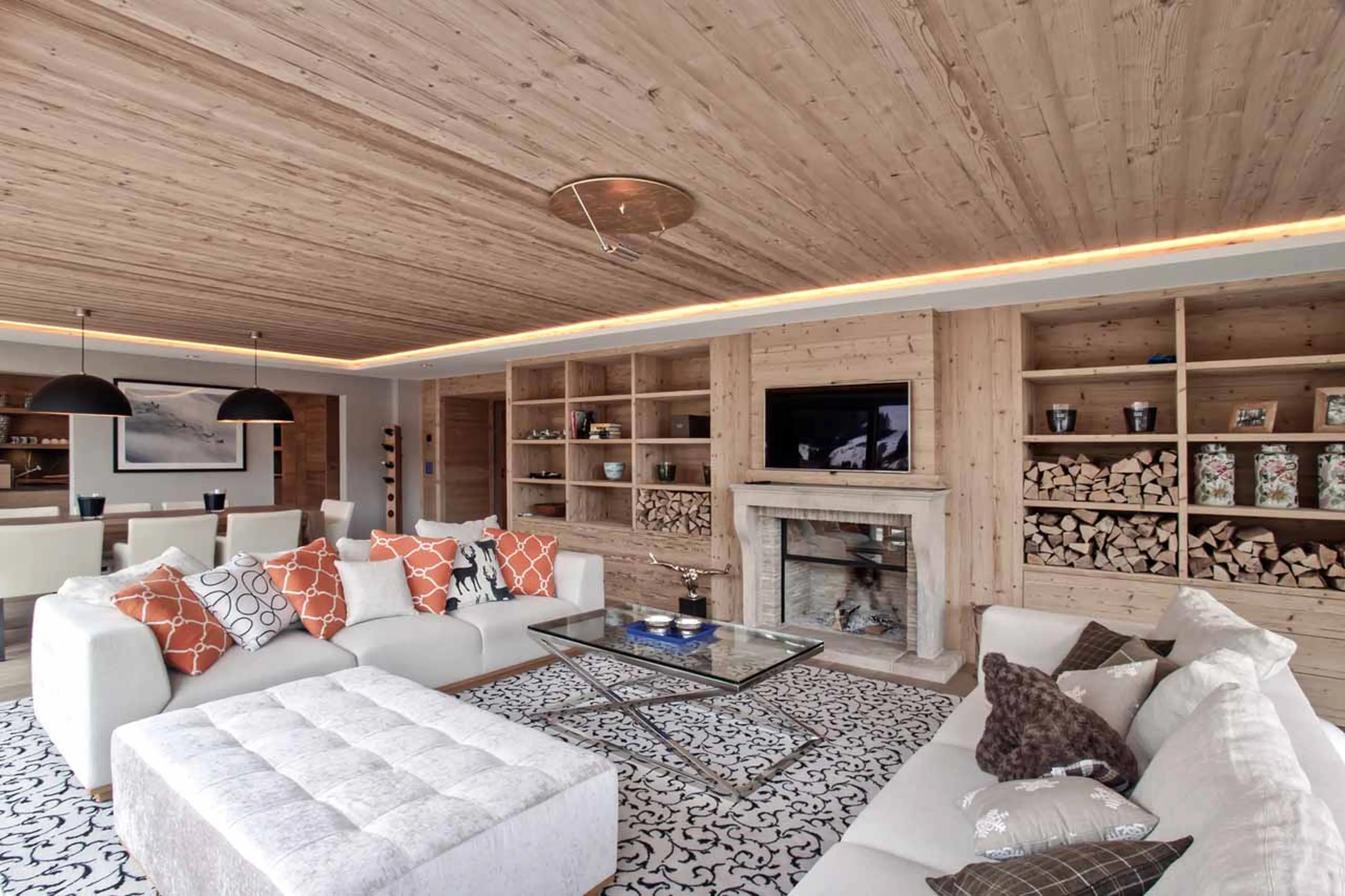 Fireplace and TV in living room at Apartment Le Cerf Rouge in Rougemont