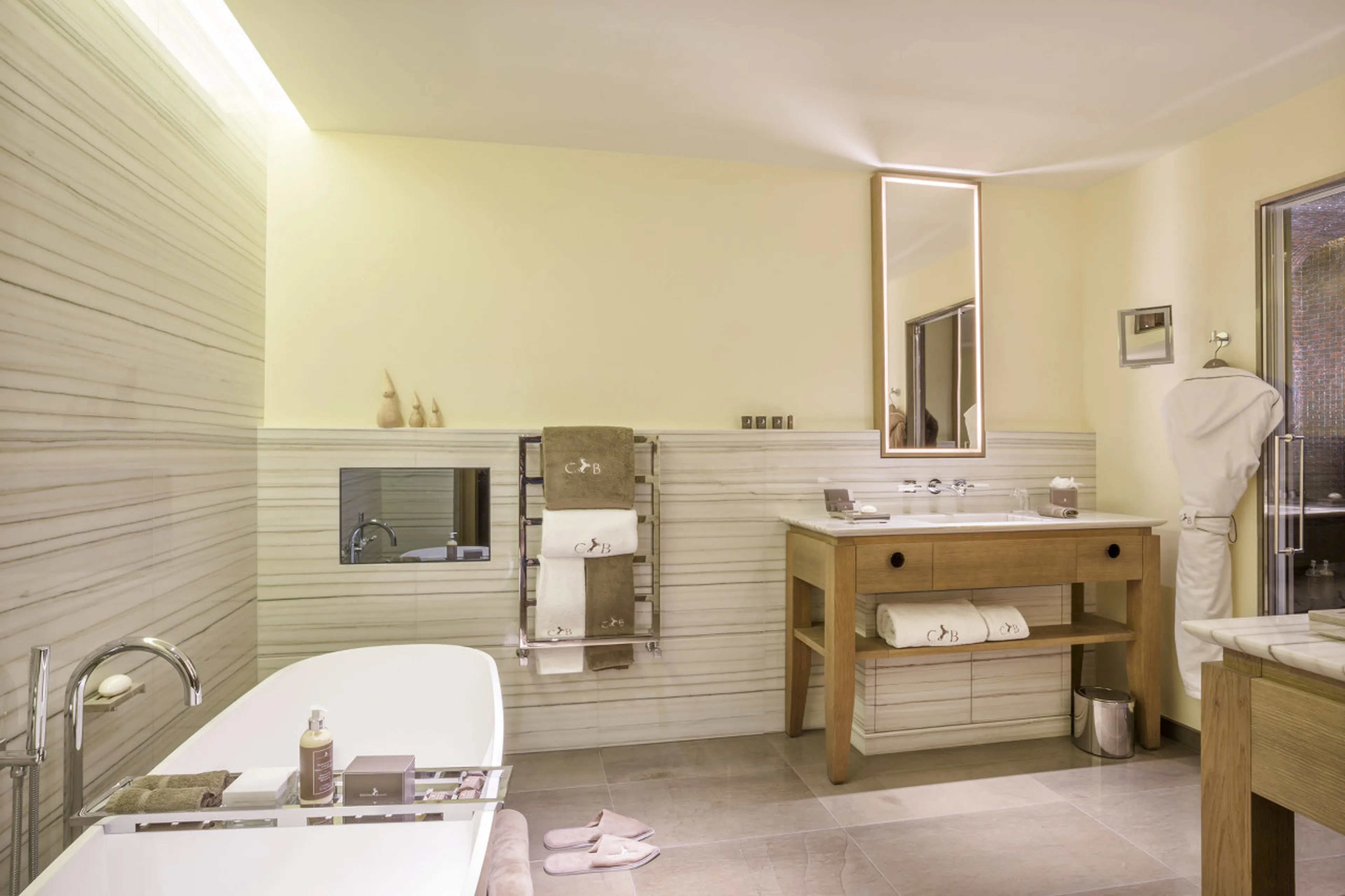 En suite bathroom with bath tub and hammam shower in Le Chalet Cheval Blanc in Courchevel 1850