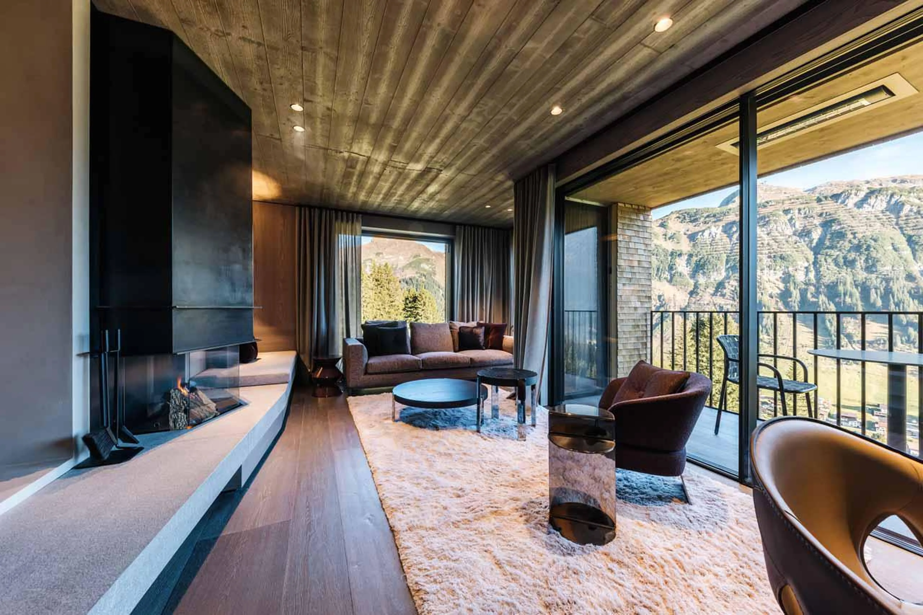 Living area with fireplace in Le Chalet, Lech