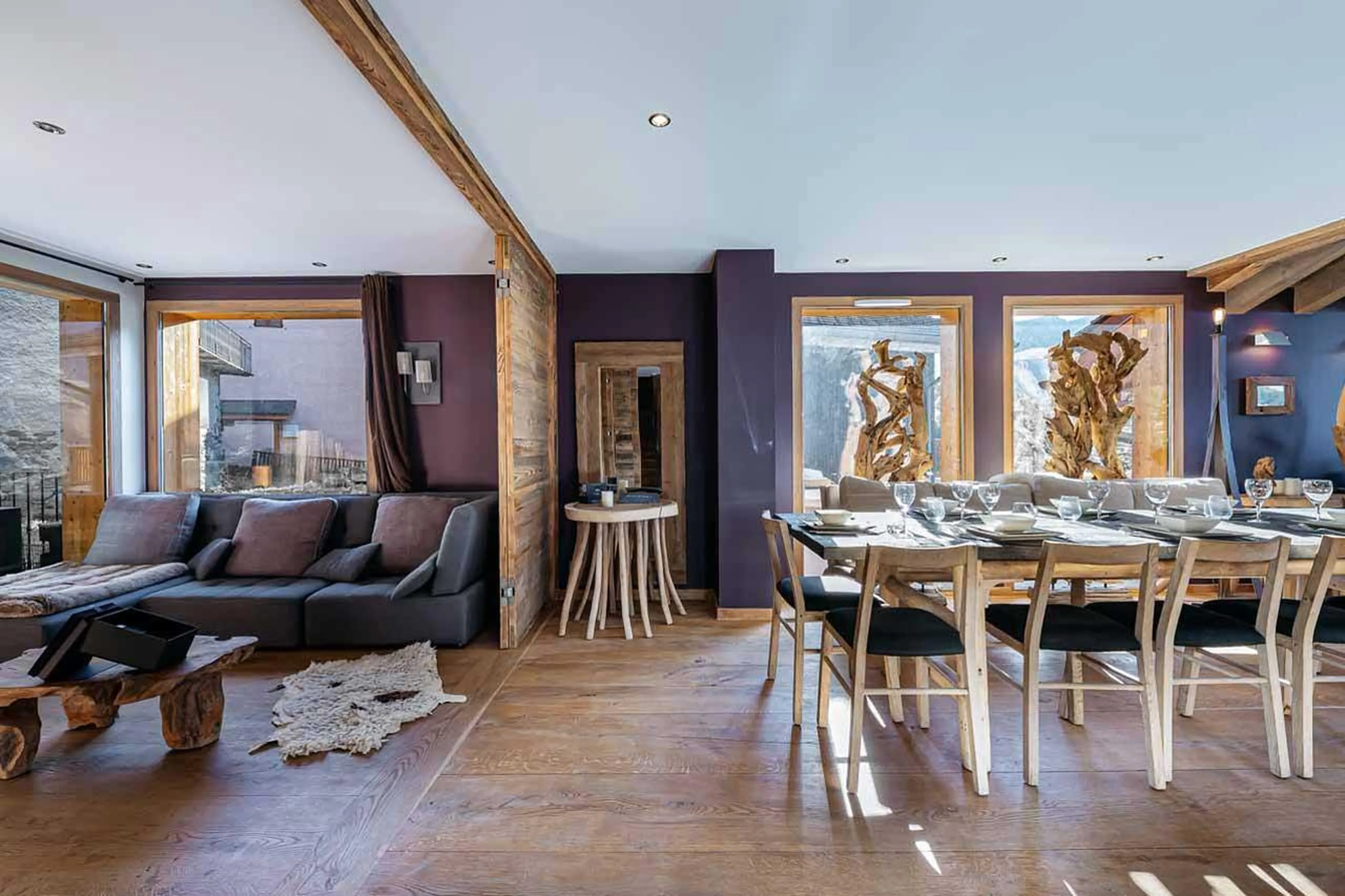 Sofa and dining table in living area of Le Chalet in St Martin de Belleville