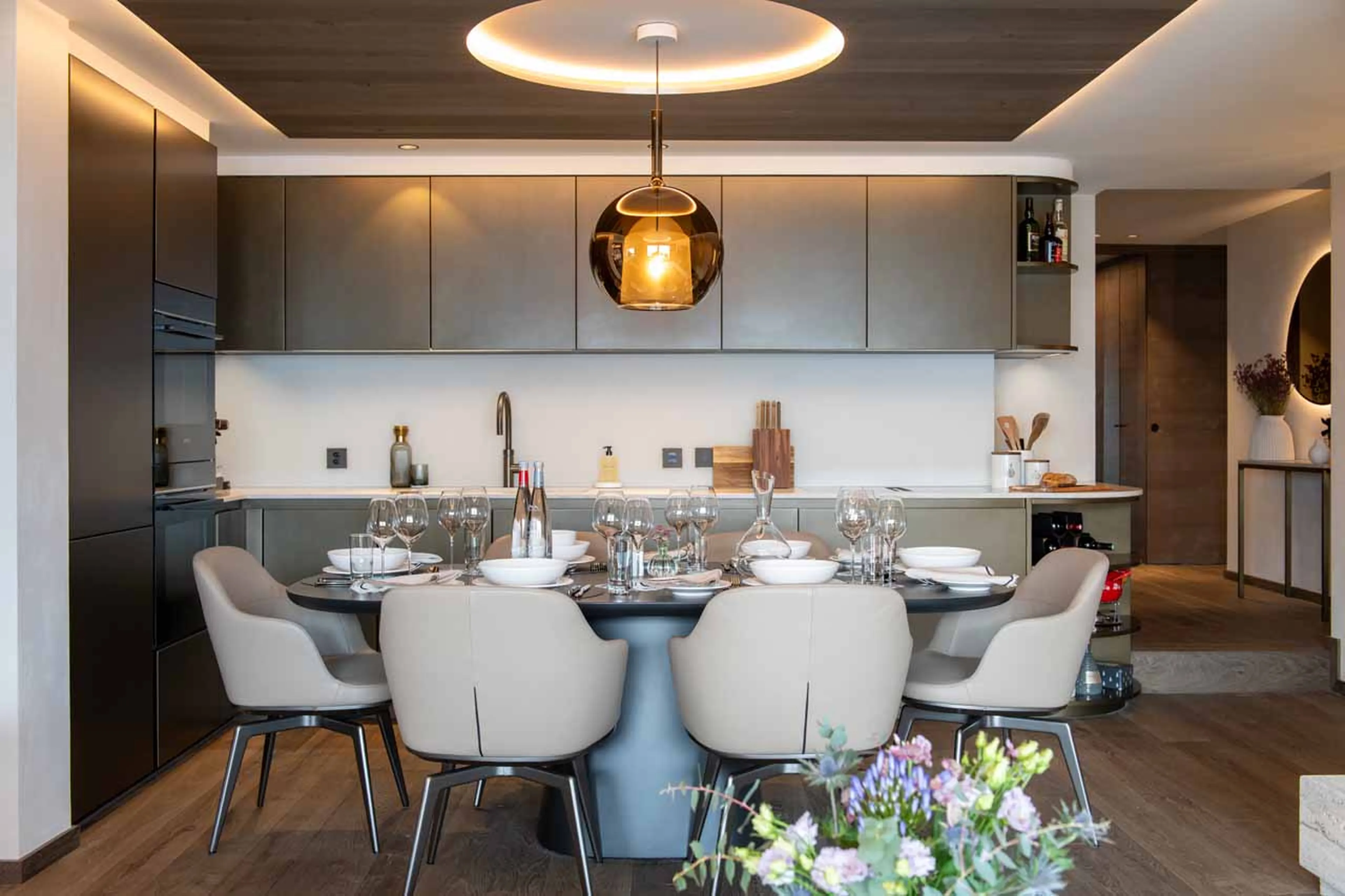 Dining table and kitchen at Le Verbier View 01 in Verbier