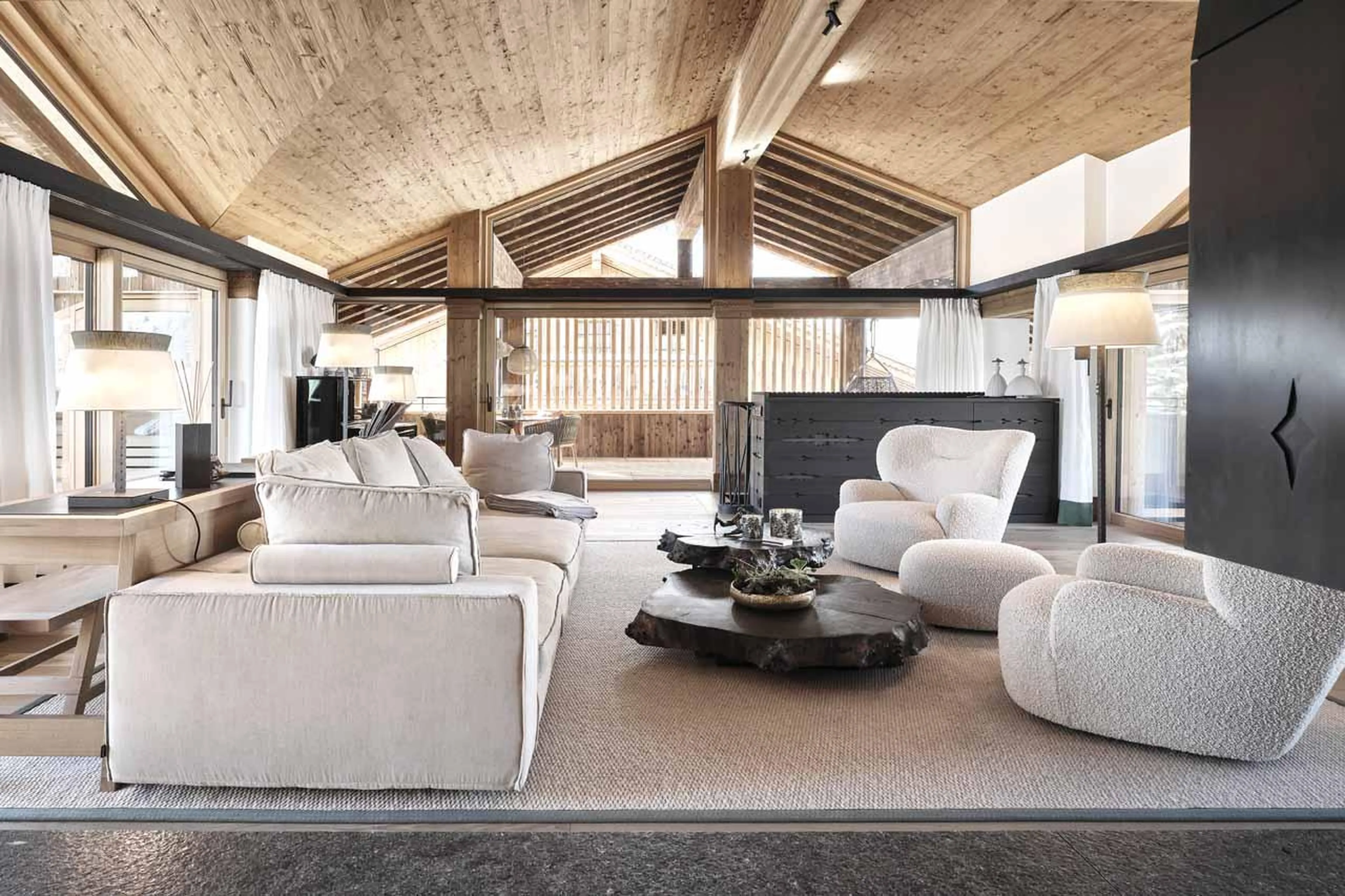 Vaulted windows and sliding glass doors on two sides in Lech Lodge Loft, Lech