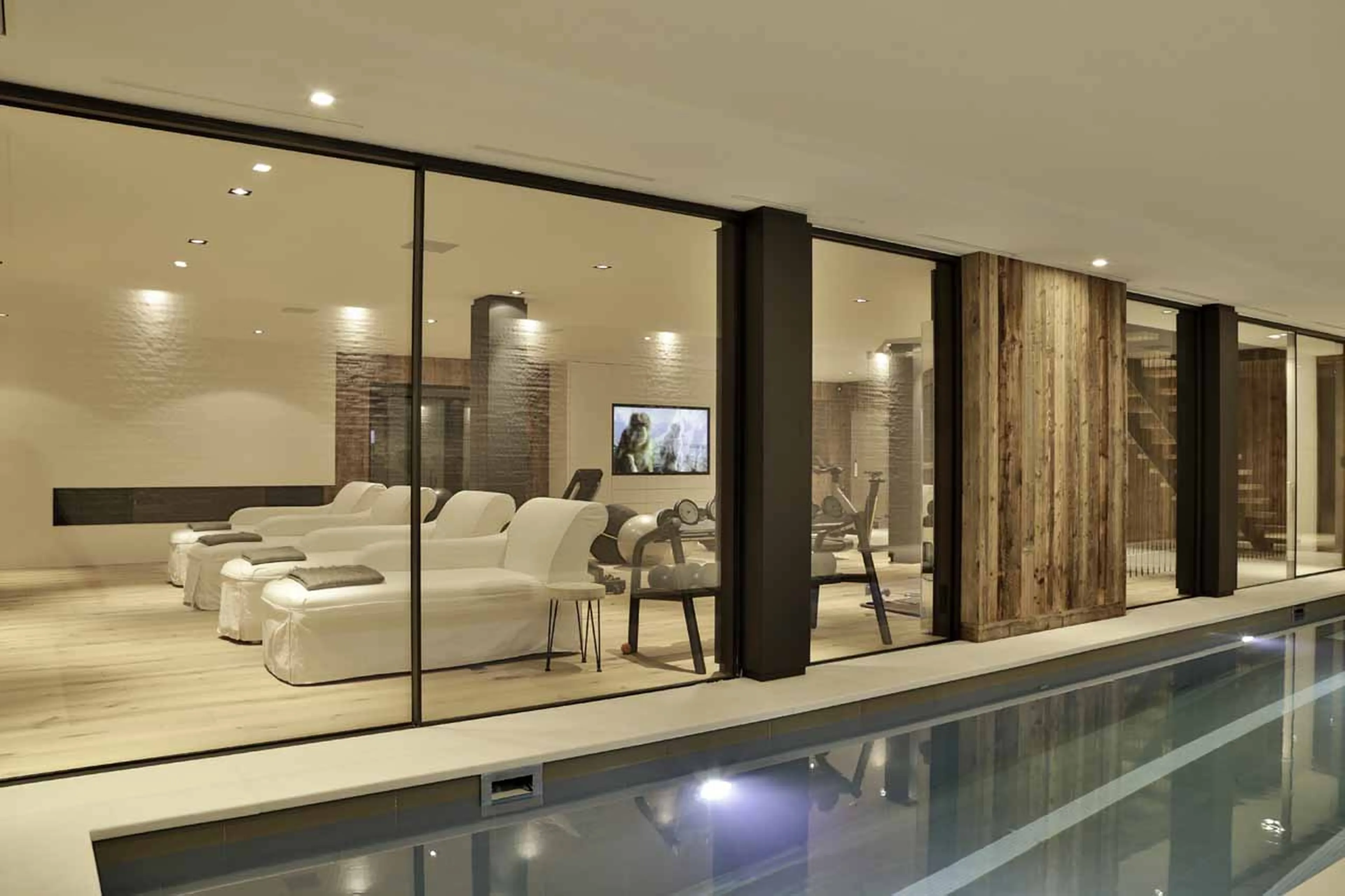 Pool and relaxation area at La Fermes a la Leonthine in Megeve