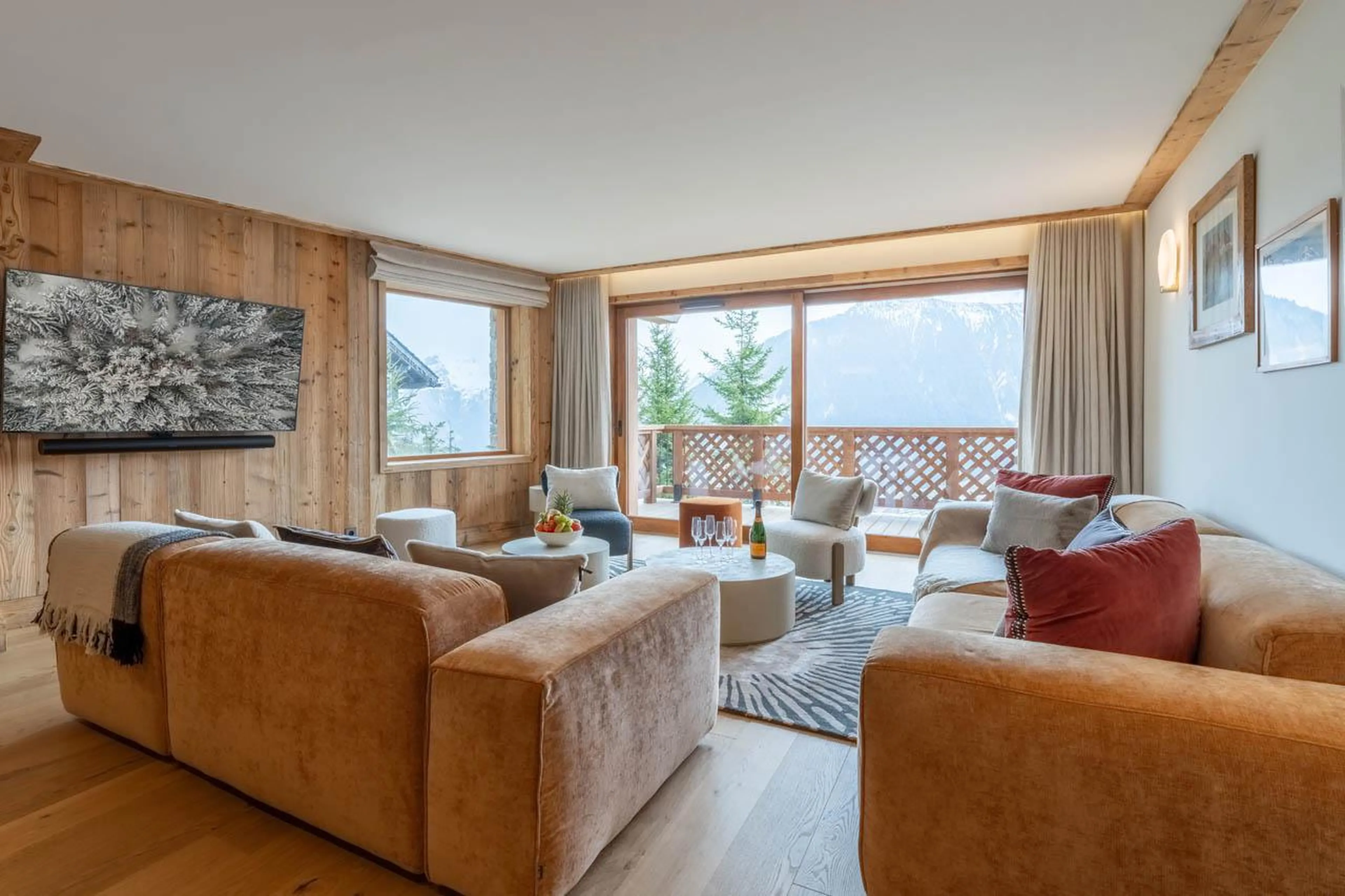 Comfortable sofa area with balcony access at Apartment Manej 4 in Courchevel 1850