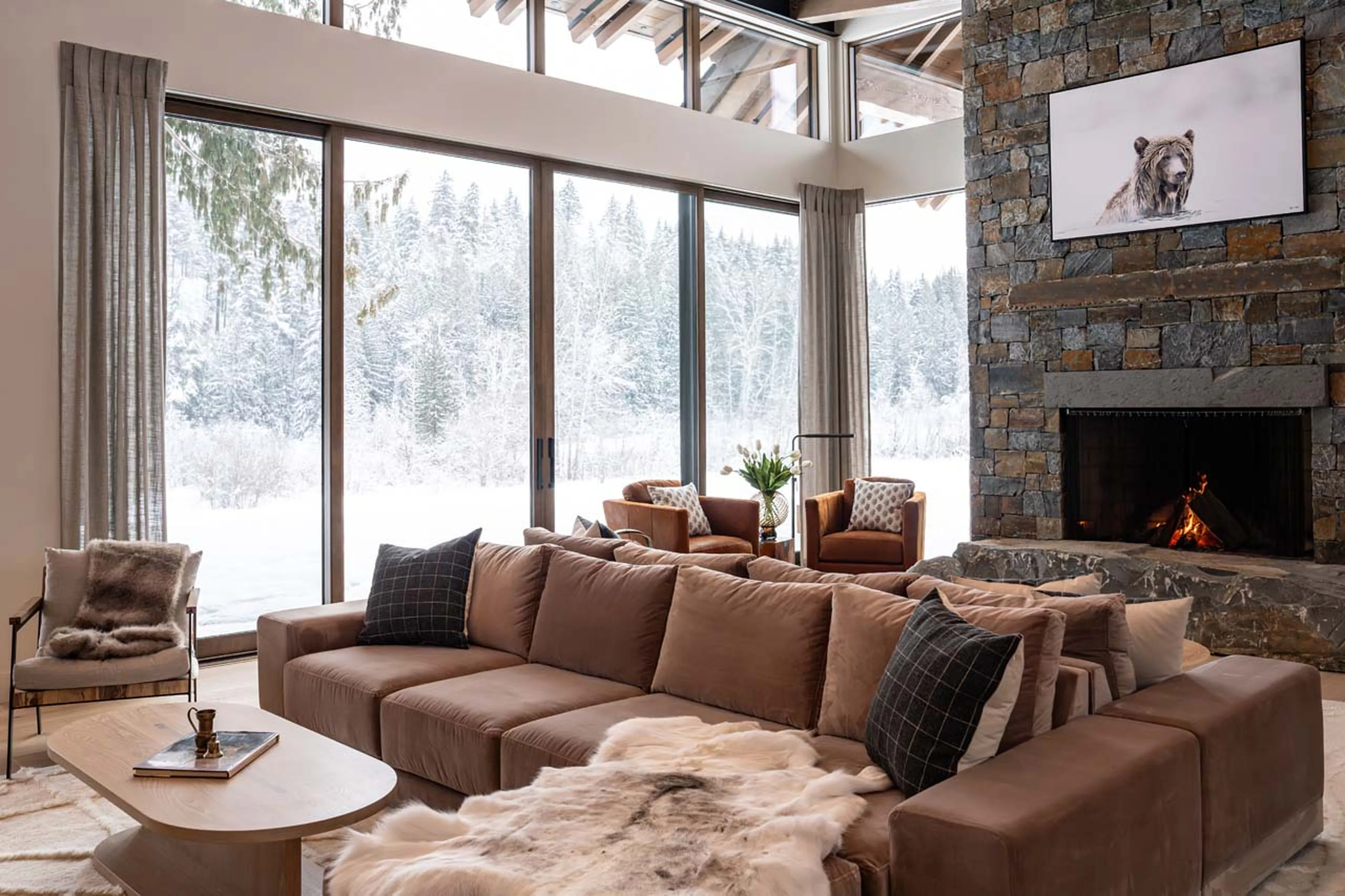 Sitting room with fireplace in Mountain Lake Chalet, Revelstoke