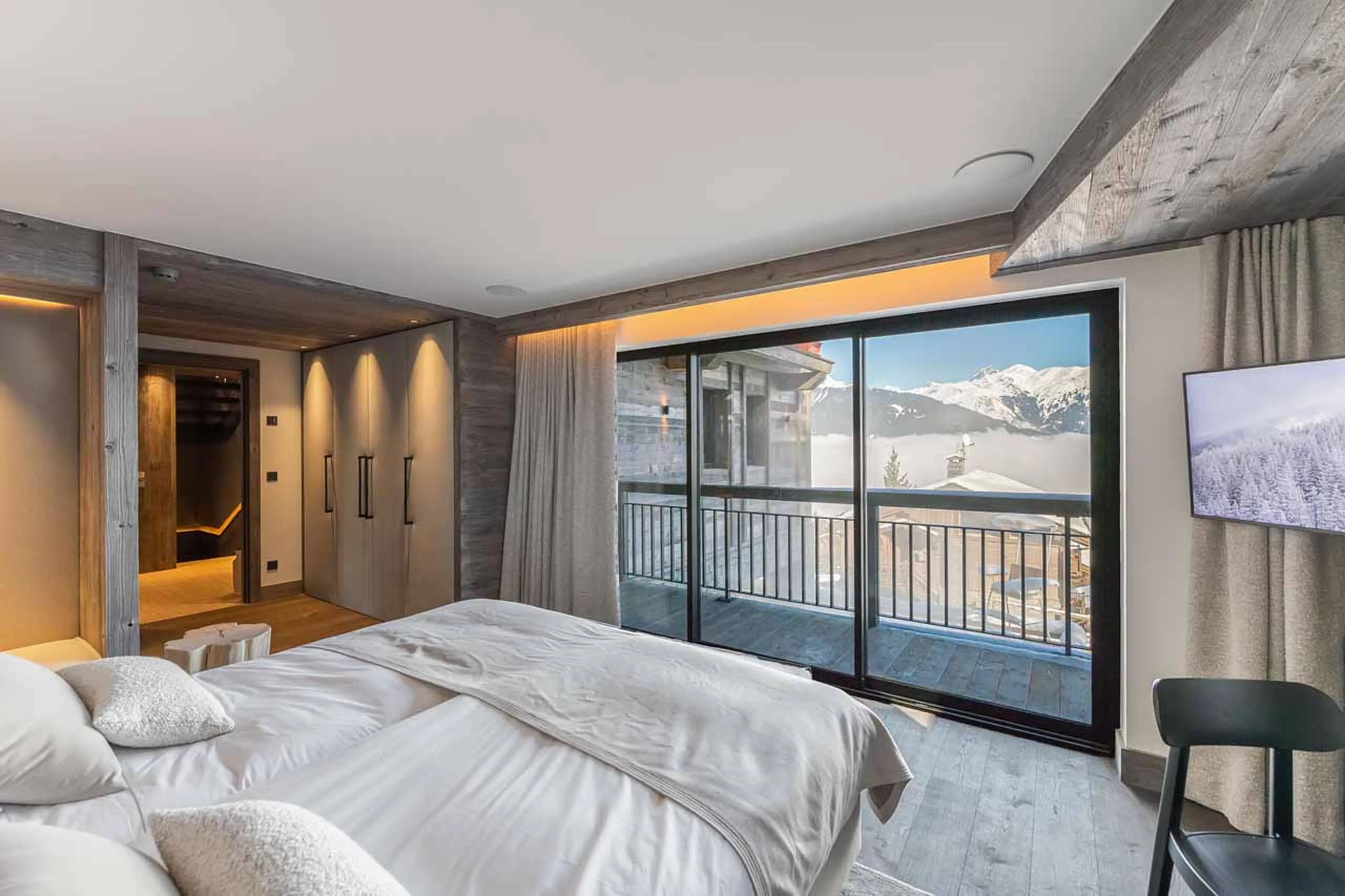 Balcony access from bedroom three at Chalet White Sand in Courchevel 1550