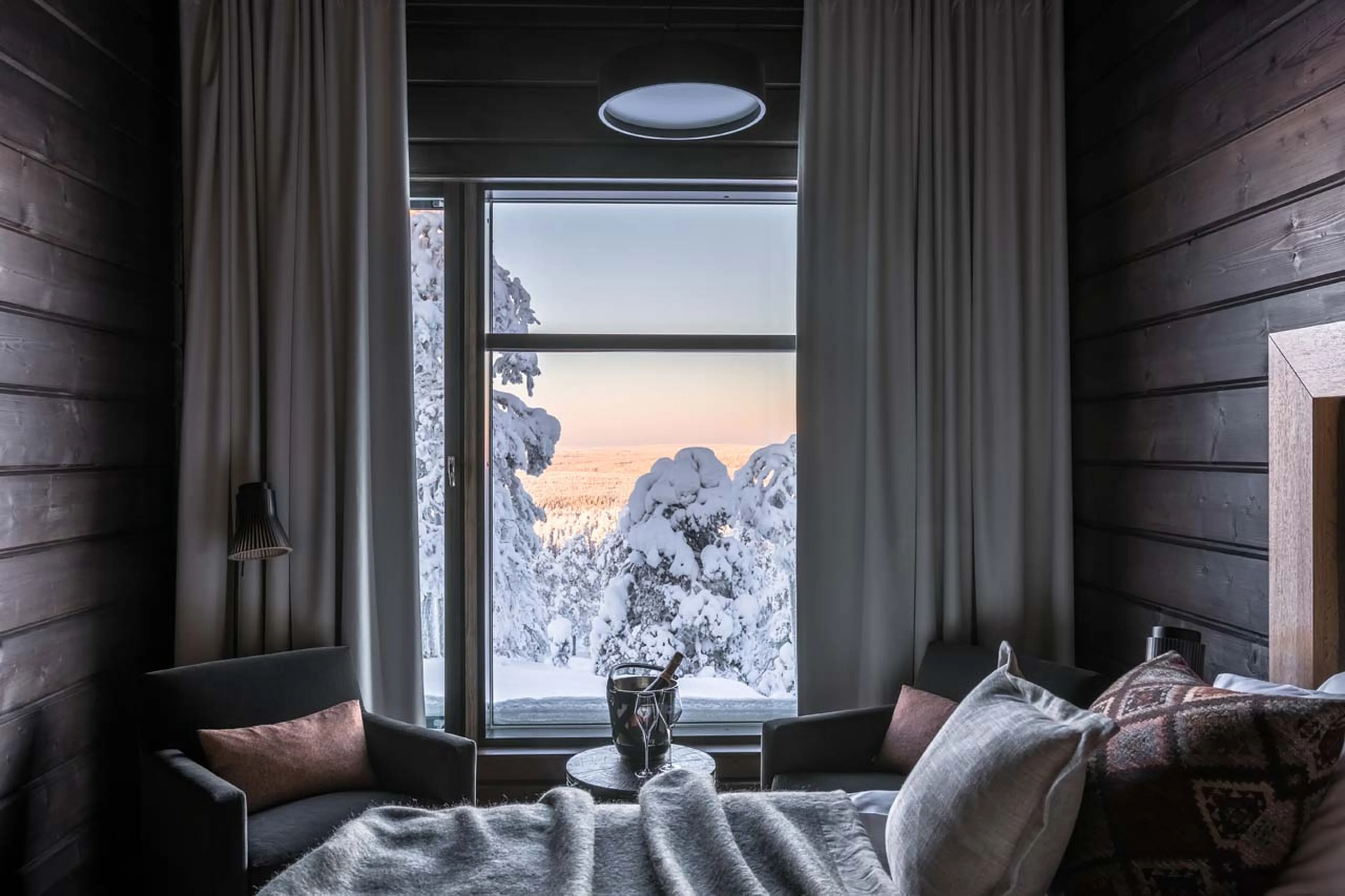 Champagne in bedroom at Octola Private Wilderness in Finland