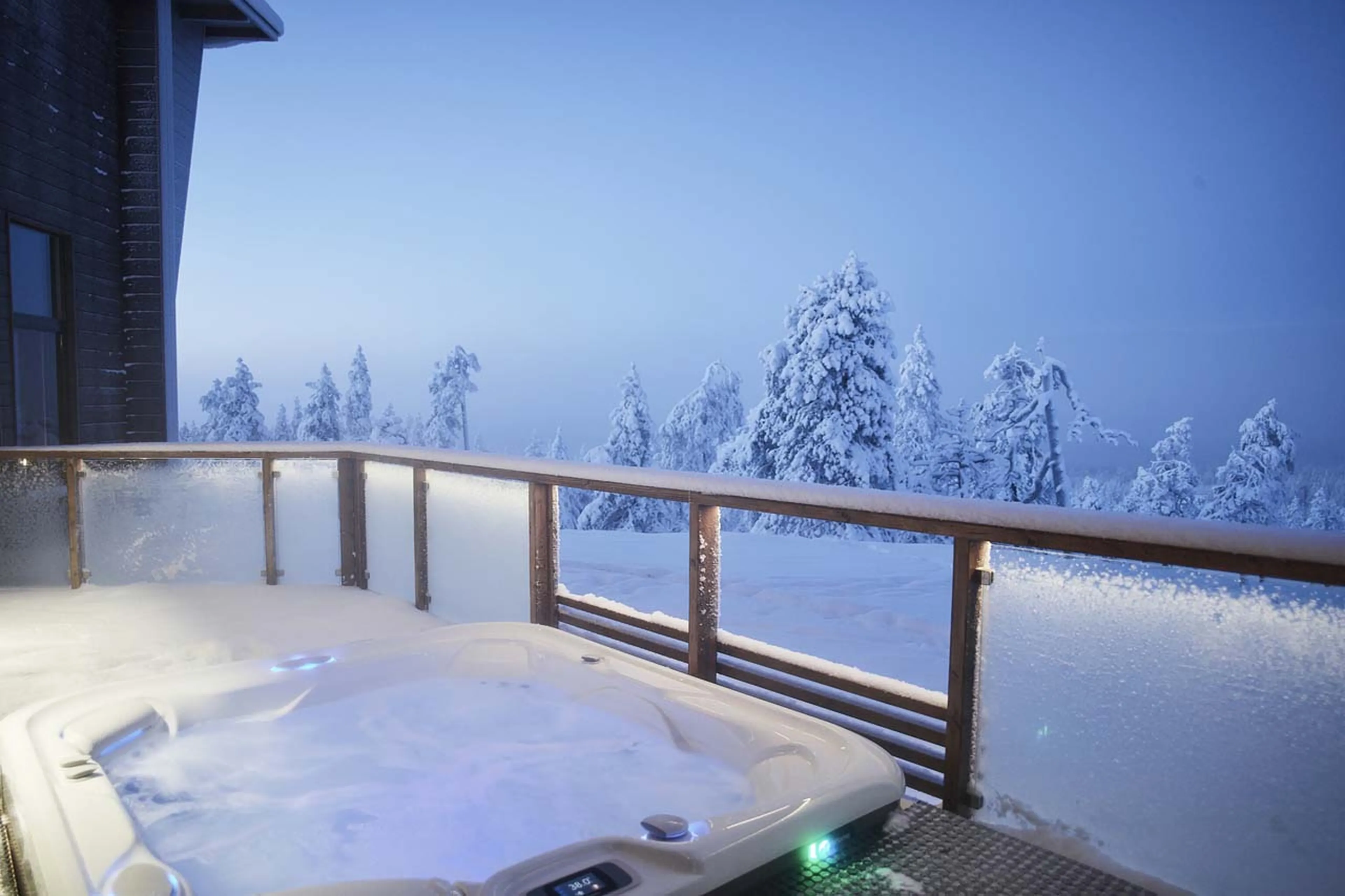 Outdoor hot tub at Octola Private Wilderness in Finland