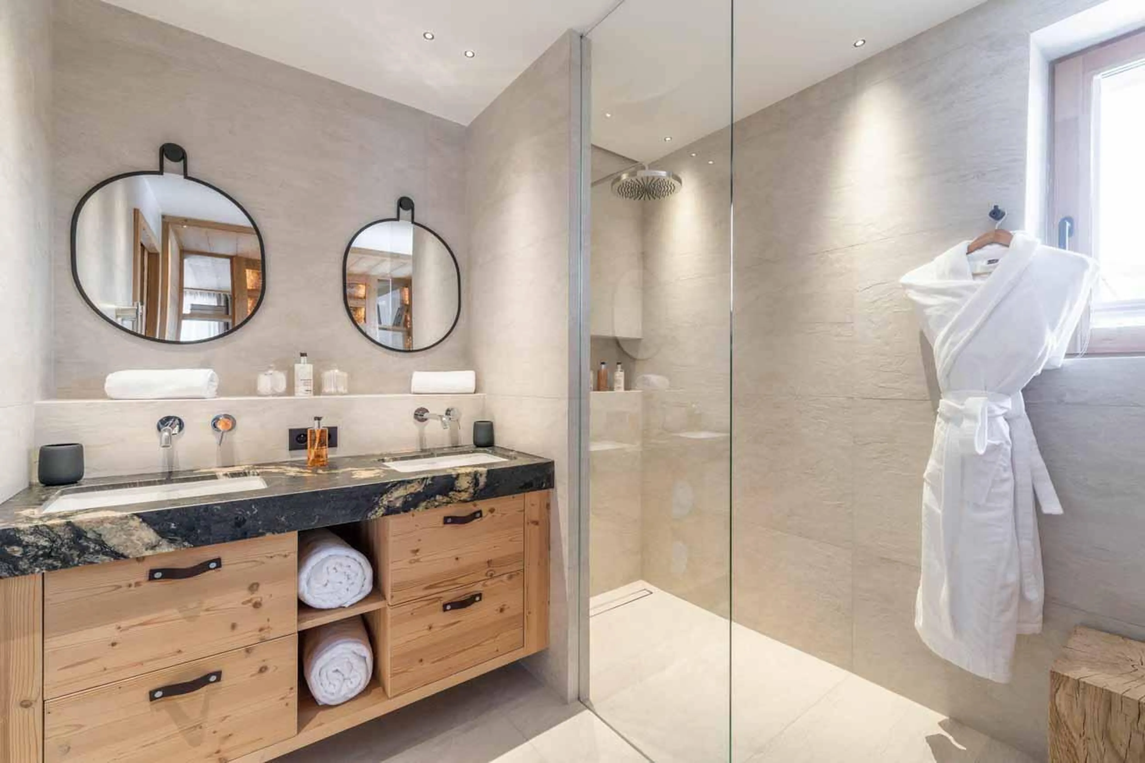 En-suite bathroom with double basin and separate shower in Chalet Beloukha, Courchevel Le Praz