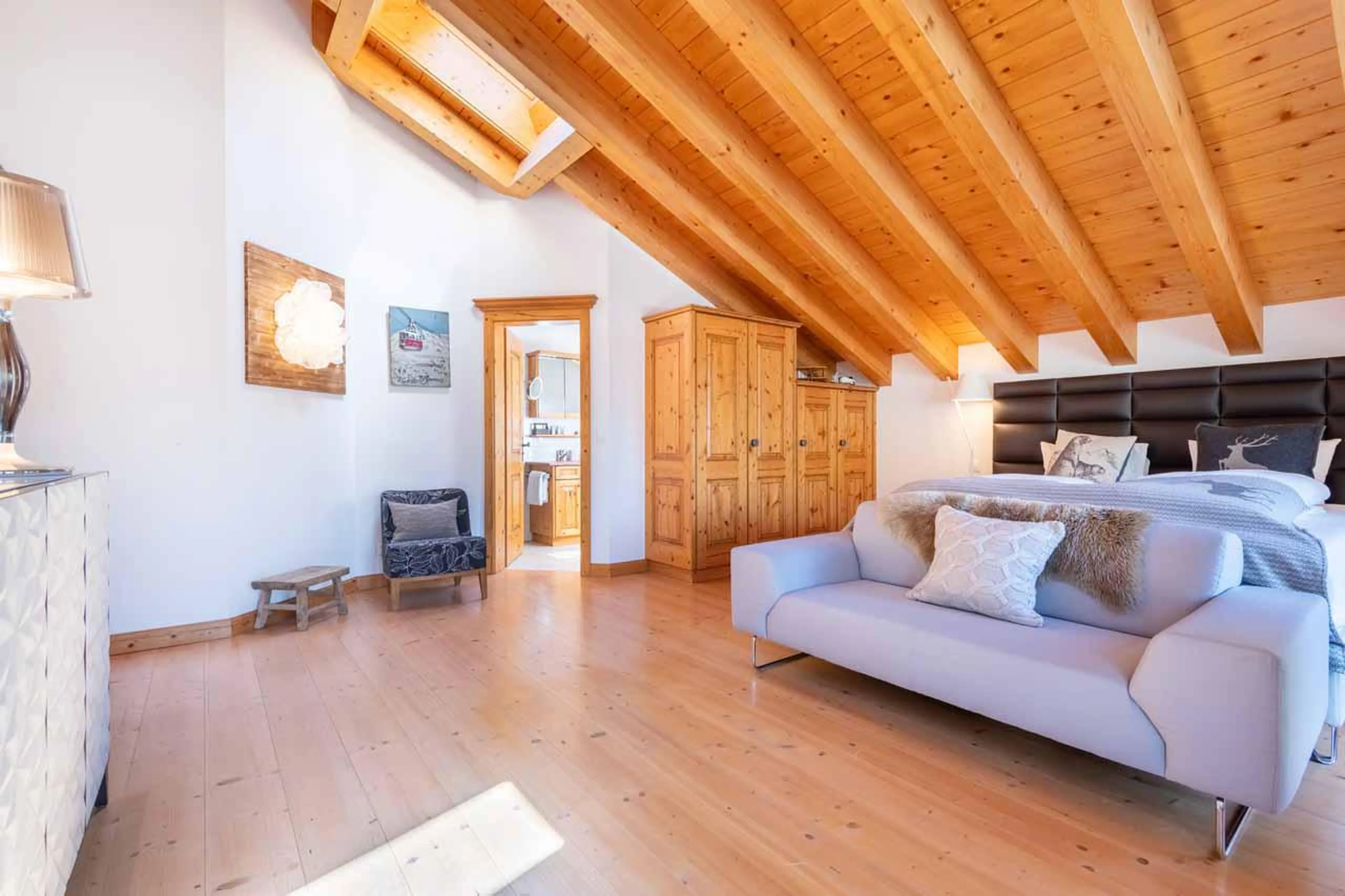 Sofa in master suite at Penthouse Annyvonne in Zermatt