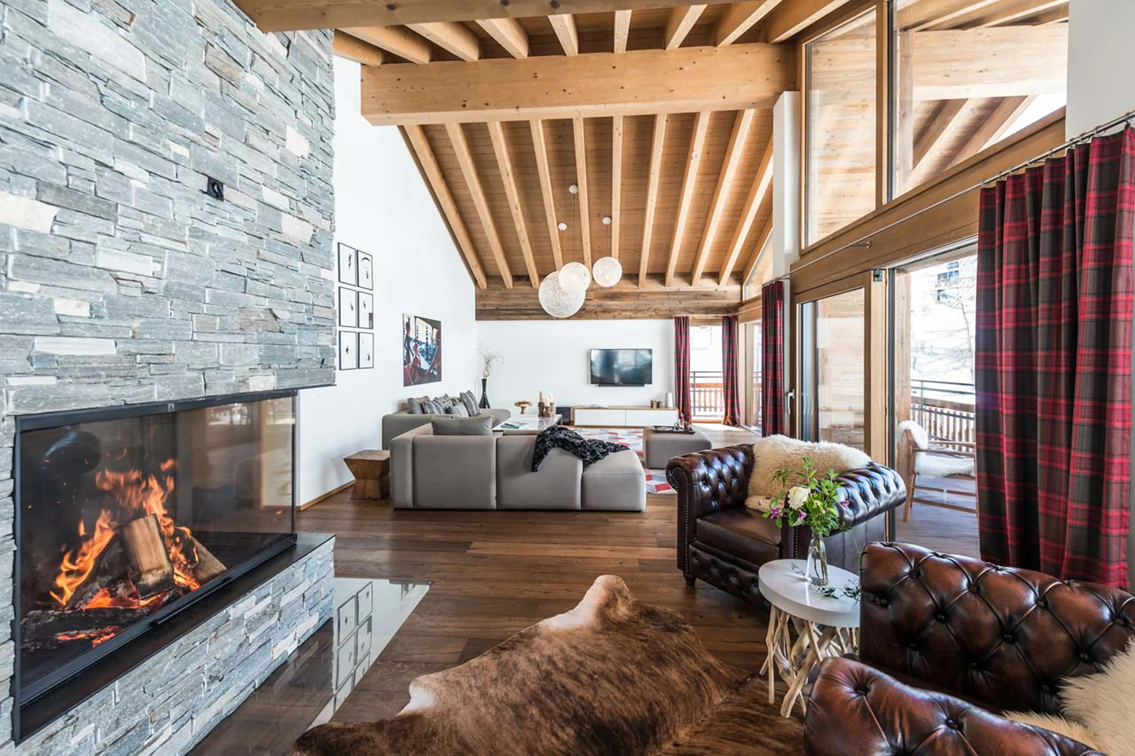 Fireplace in living area at Penthouse Aria in Zermatt