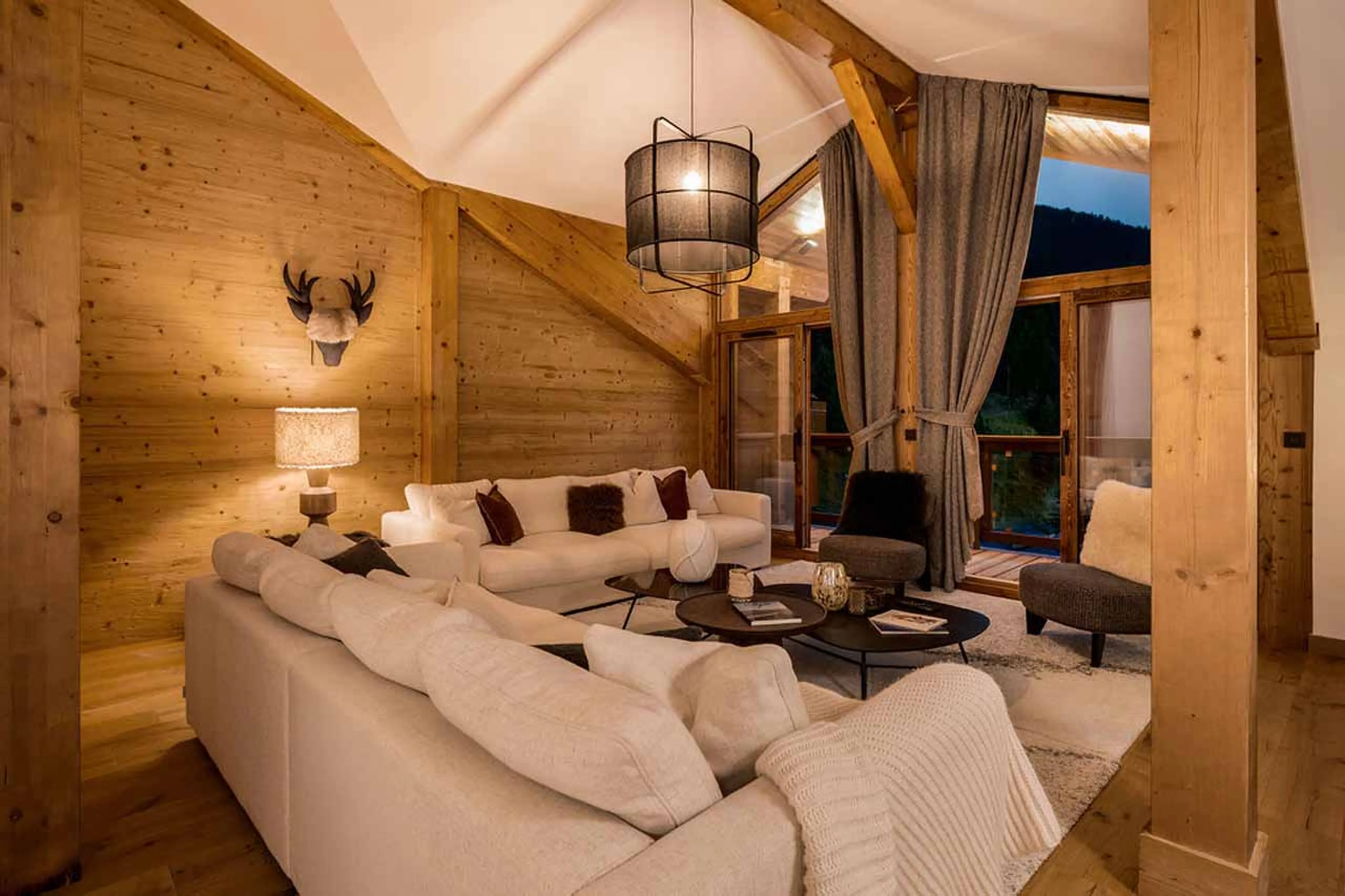 Living room in the evening at Penthouse Astral in Courchevel 1650