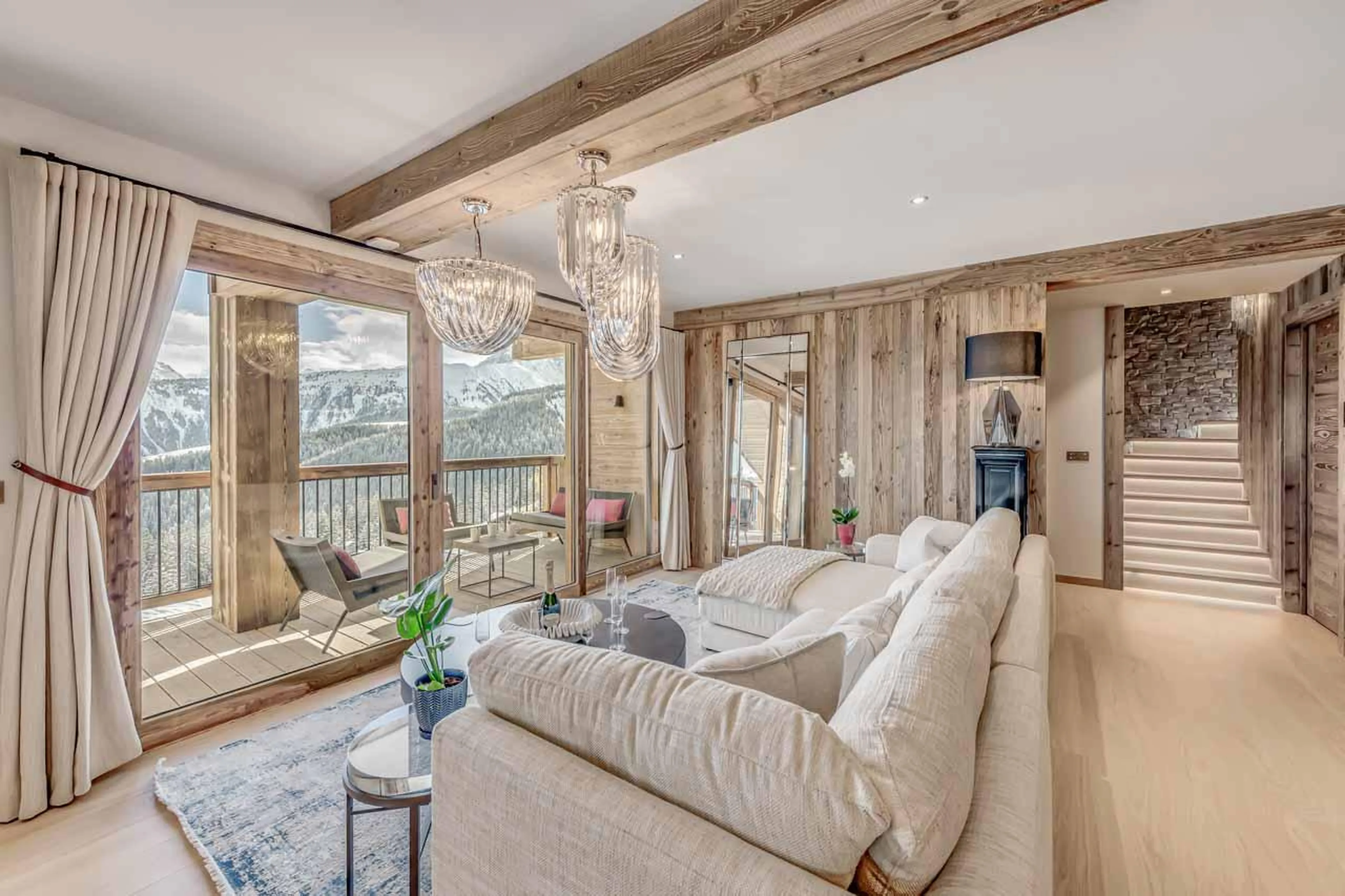 Floor-to-ceiling windows with breathtaking mountain views at Penthouse B in Courchevel 1850