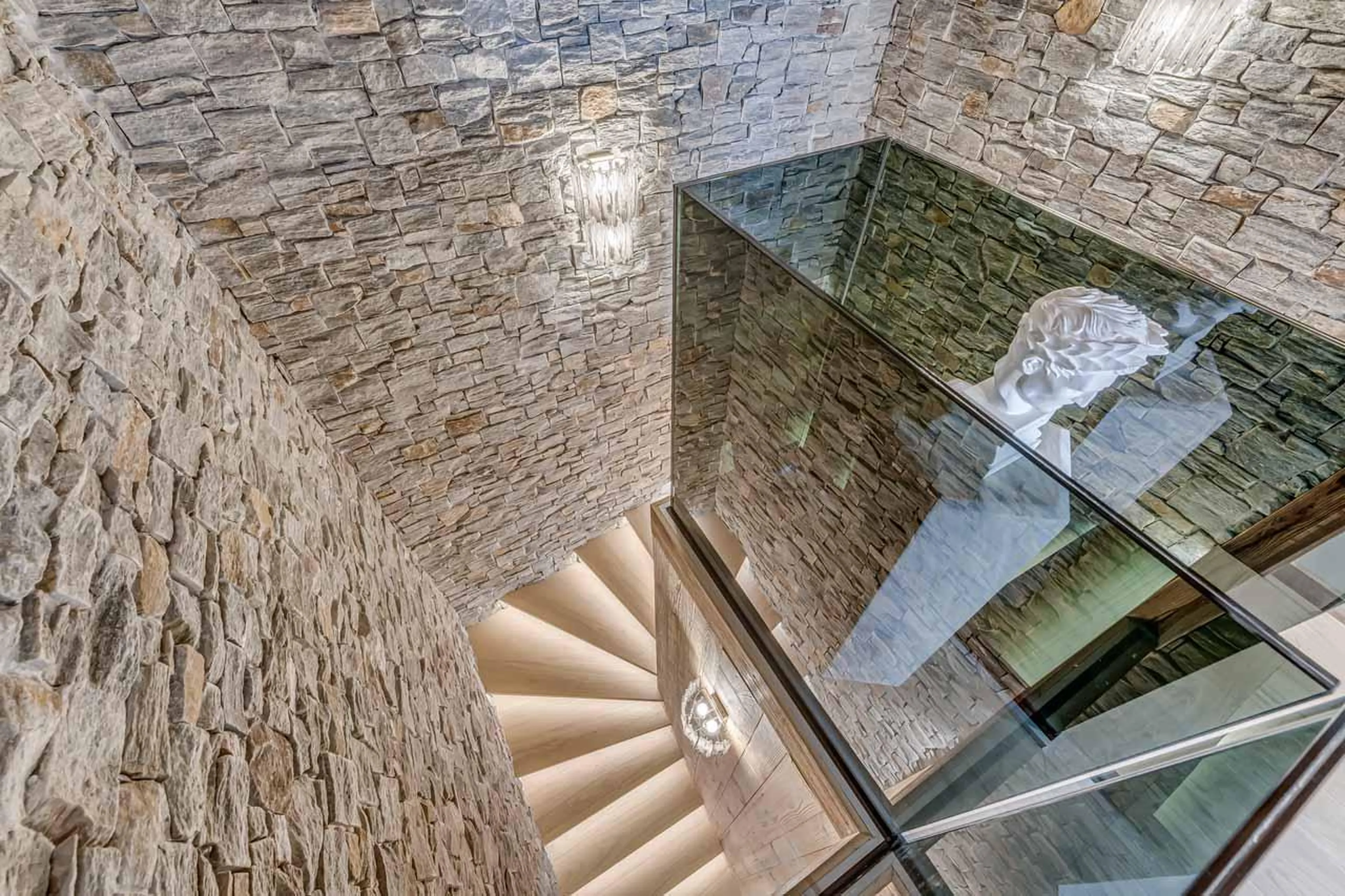Wooden stairwell with artwork at Penthouse B in Courchevel 1850