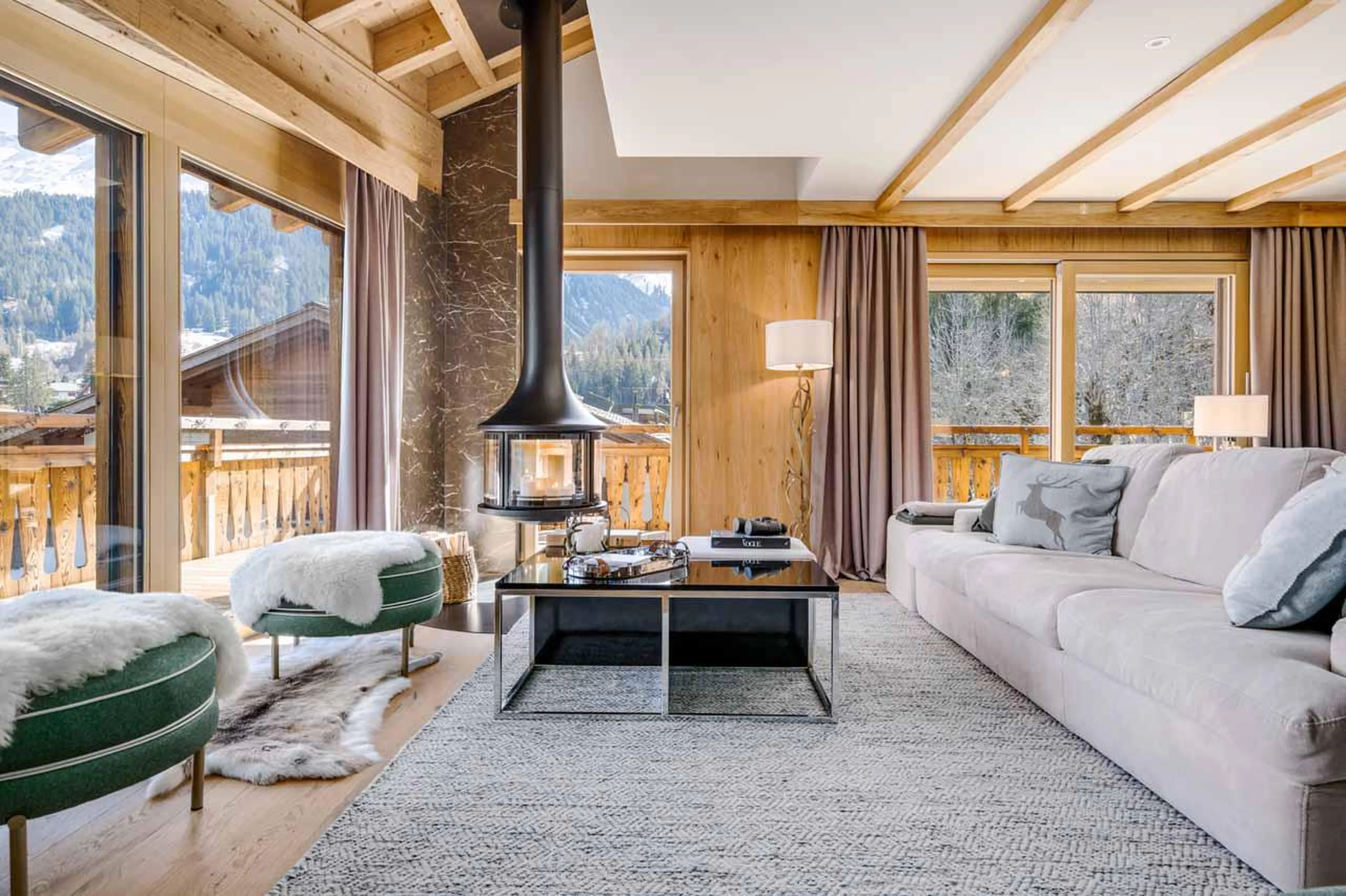 Sofas and fireplace at Penthouse Silvretta in Klosters