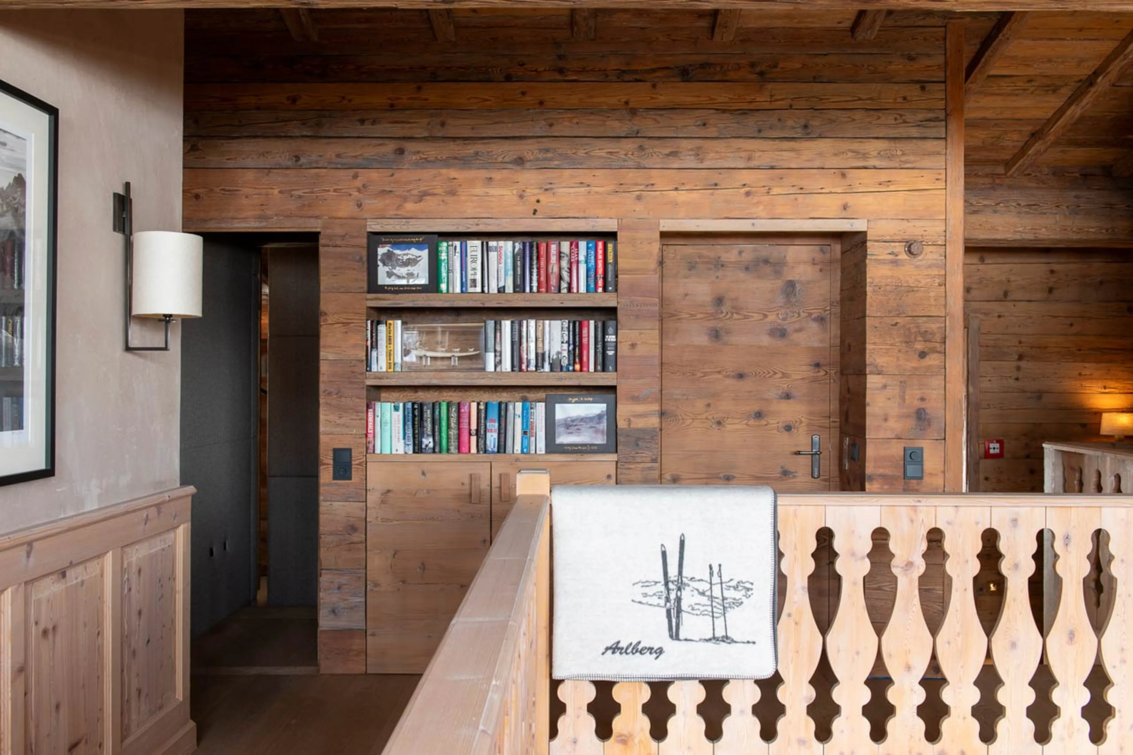 Bookshelf on gallery at Skyfall Penthouse in St Christoph