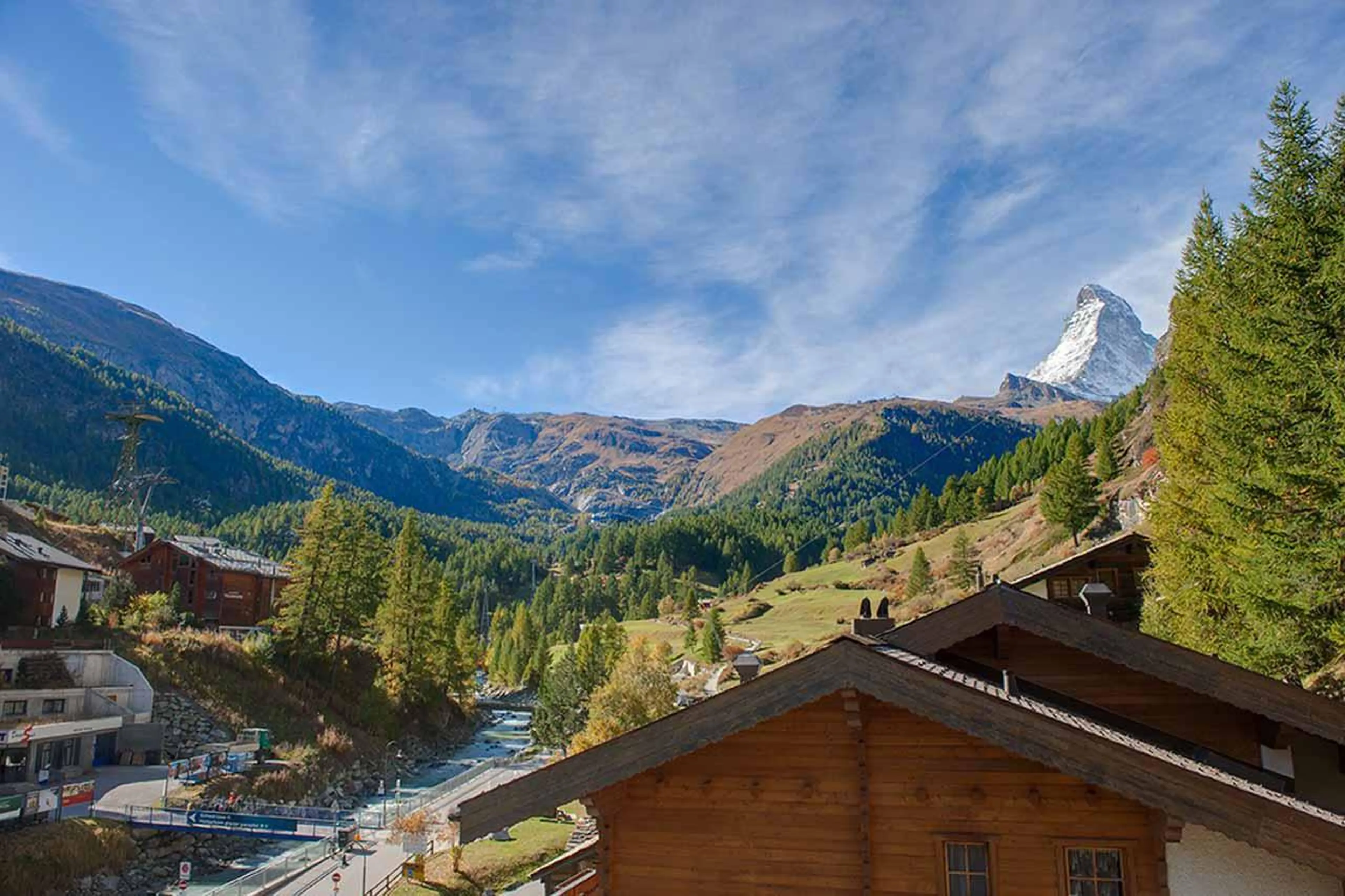 Sunny mountain views from balcony at Penthouse Zen in Zermatt