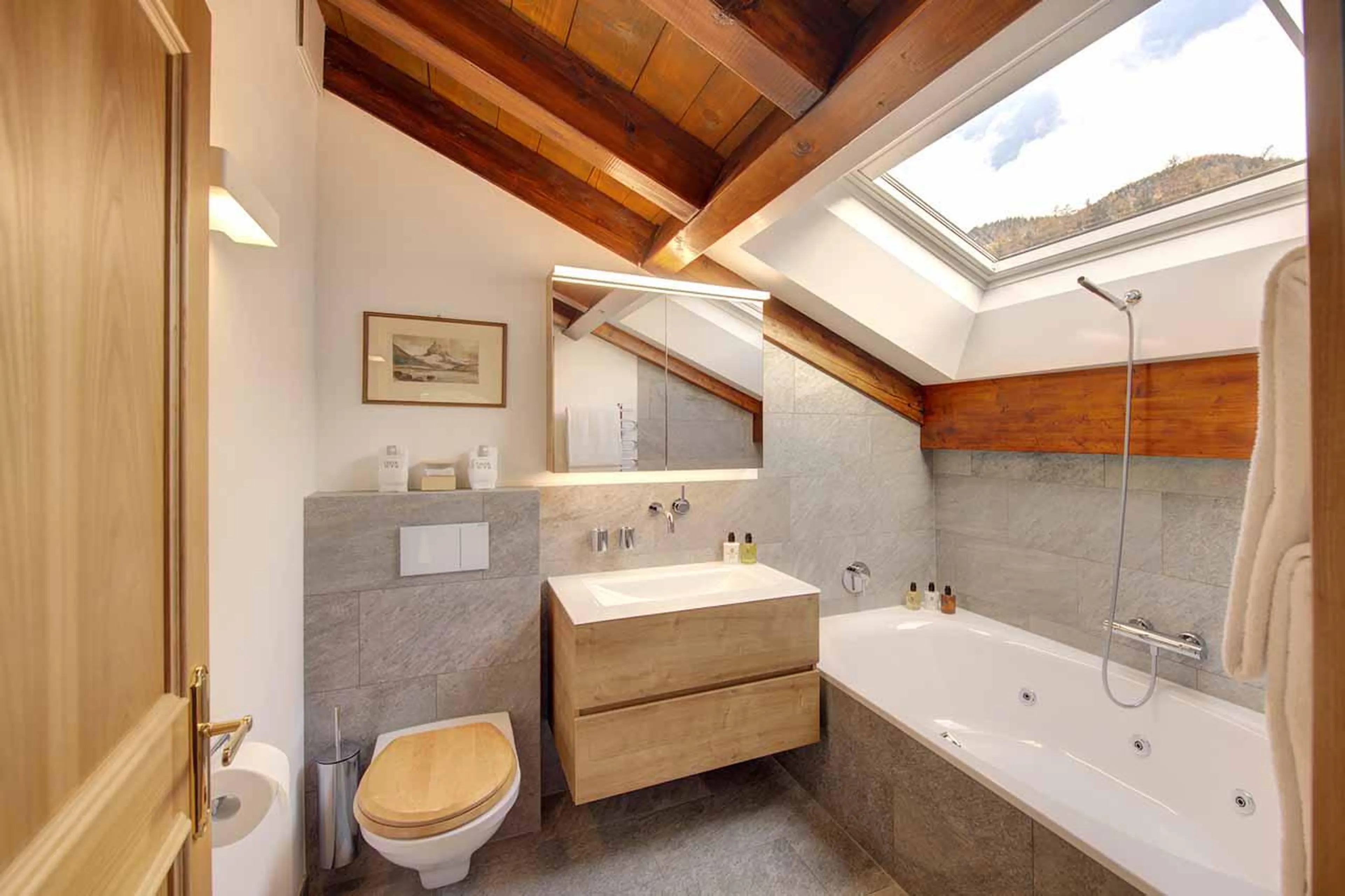 En-suite bathroom with bath at Penthouse Zen in Zermatt