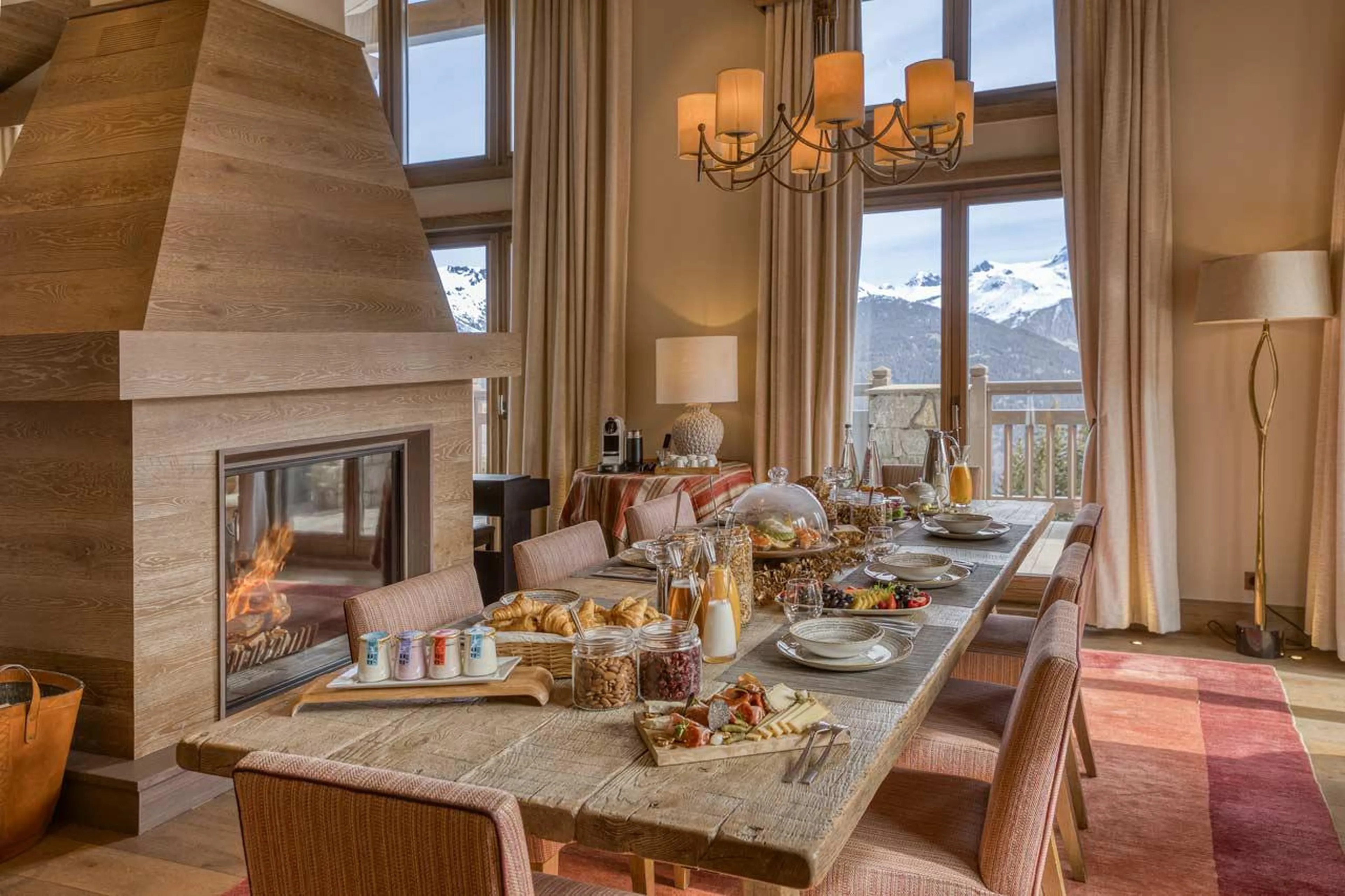 Dining room leading onto terrace with barbeque area, in Shemshak Lodge in Courchevel 1850