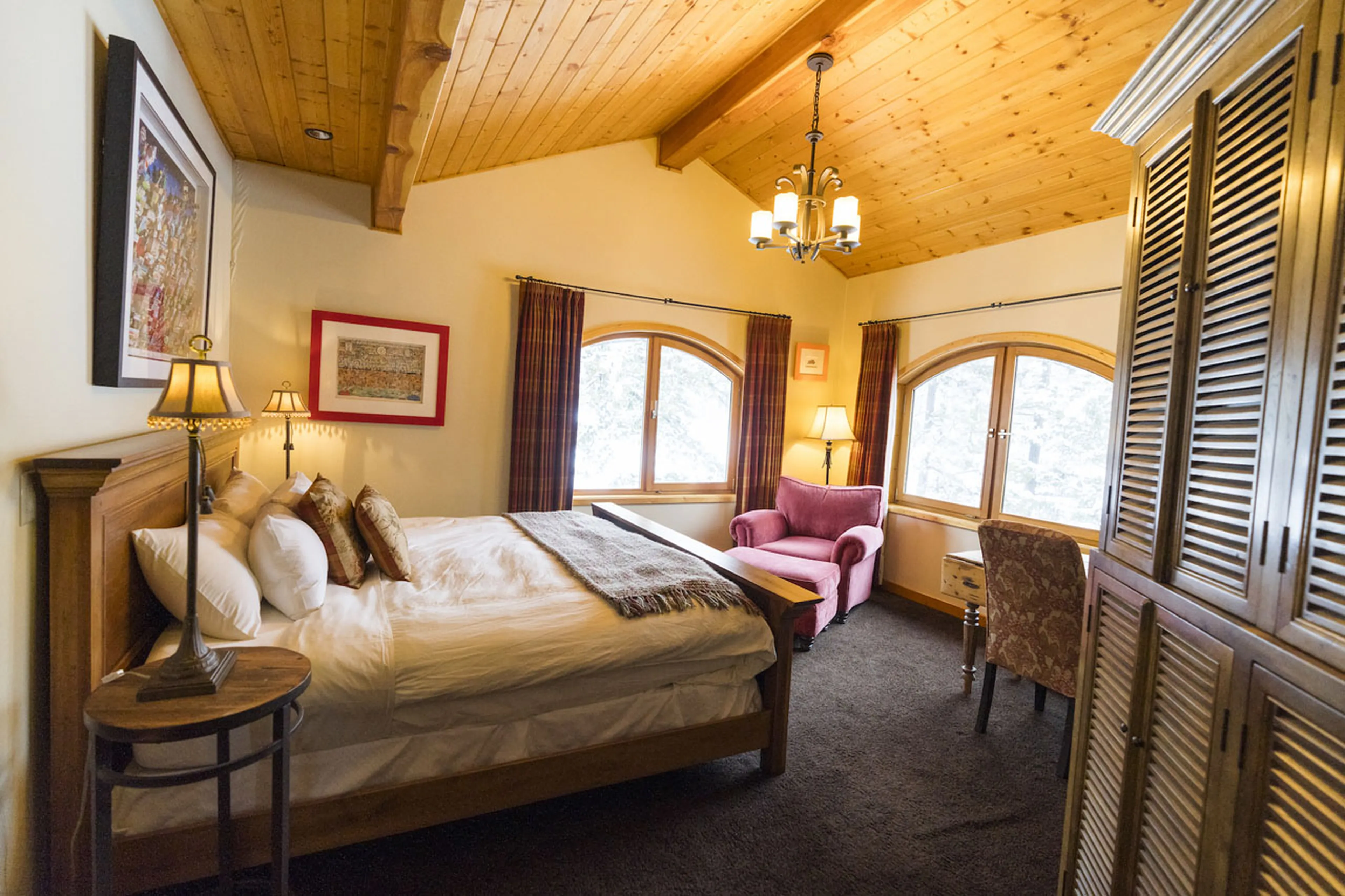 Master bedroom with storage at Spirit Bear Lodge in South Chilcotin, British Columbia