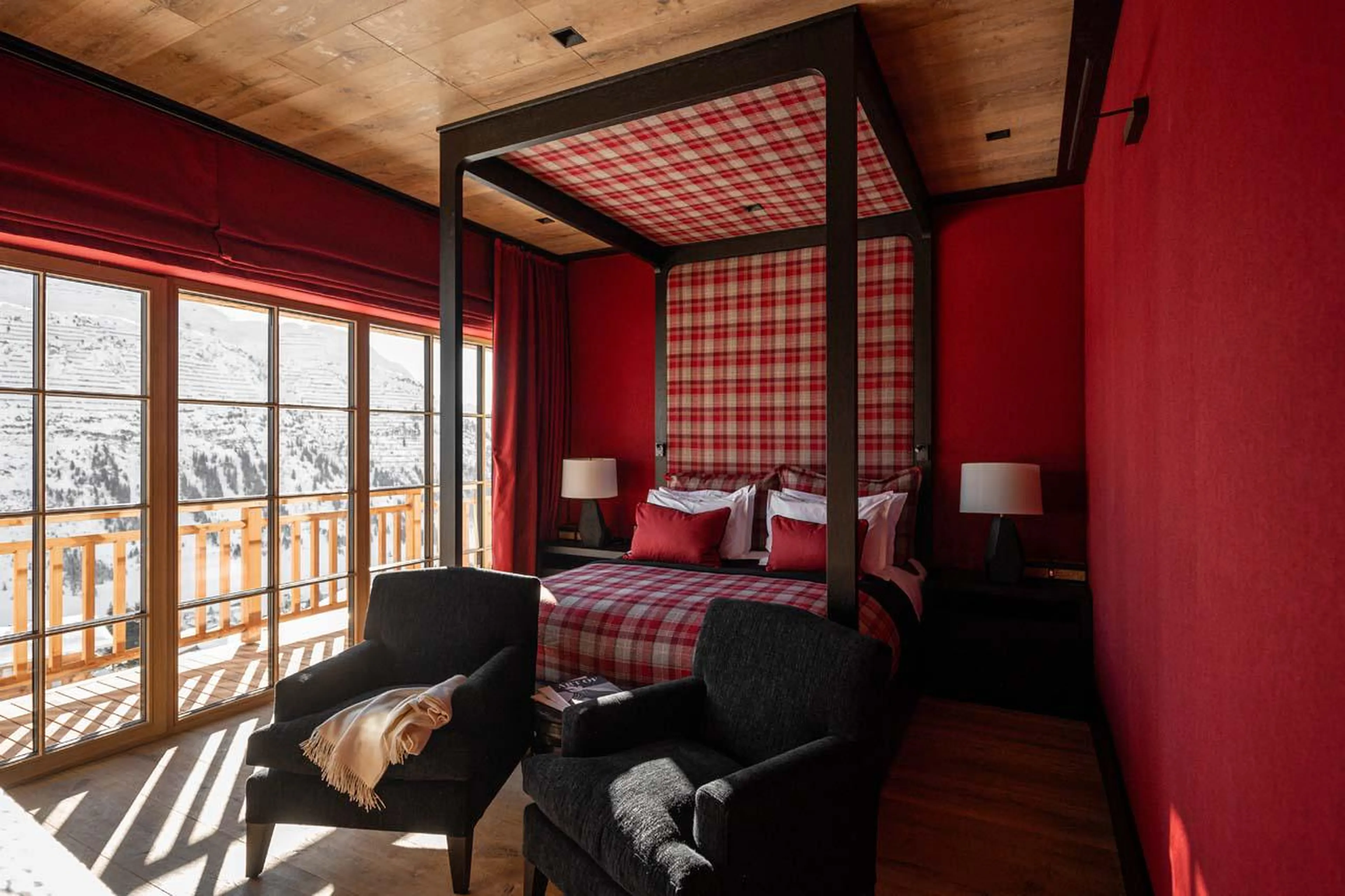 Double bedroom with balcony access and en-suite shower room at The Barn in Lech