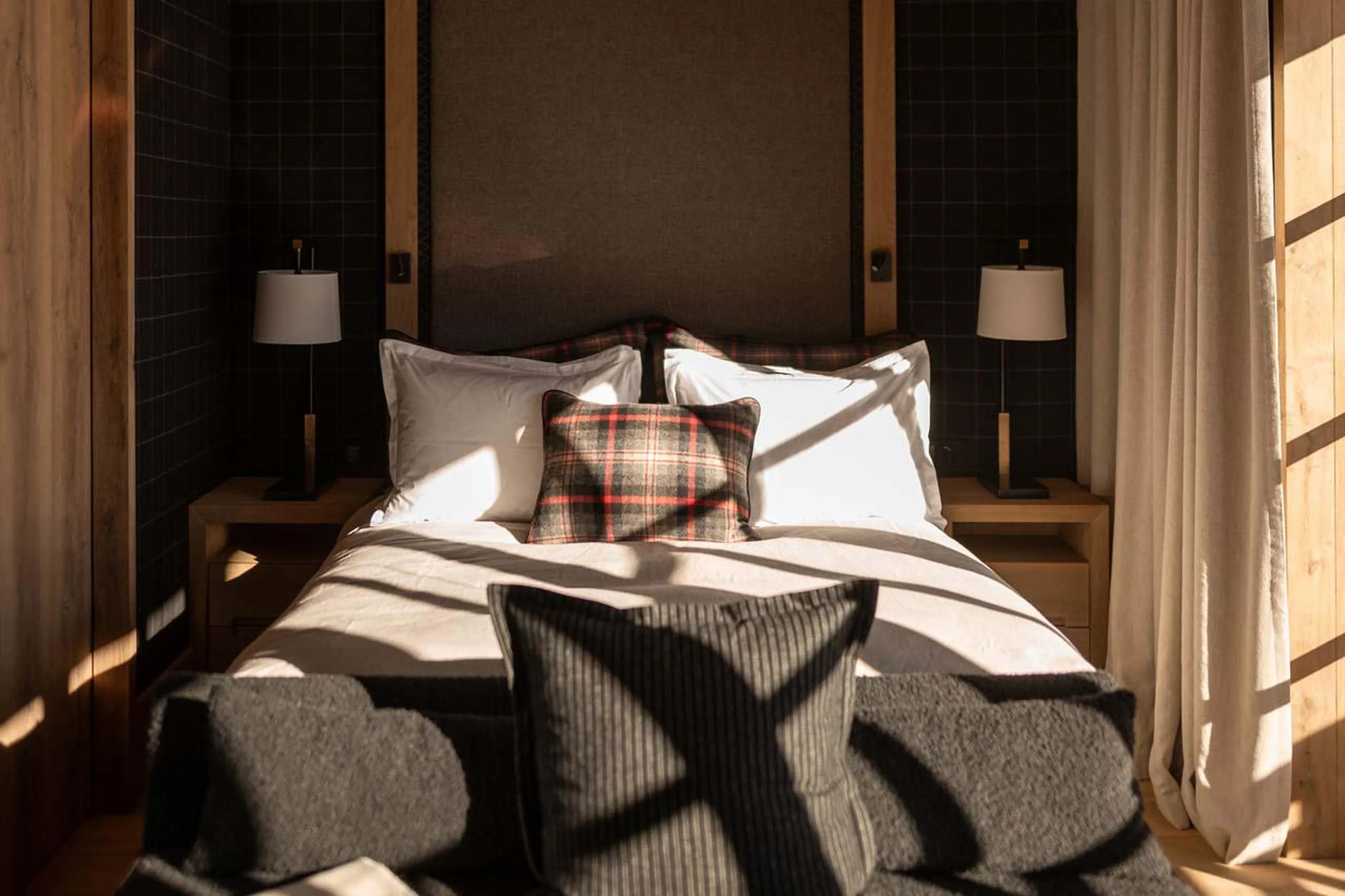 Double bedroom with seating space at The Barn in Lech