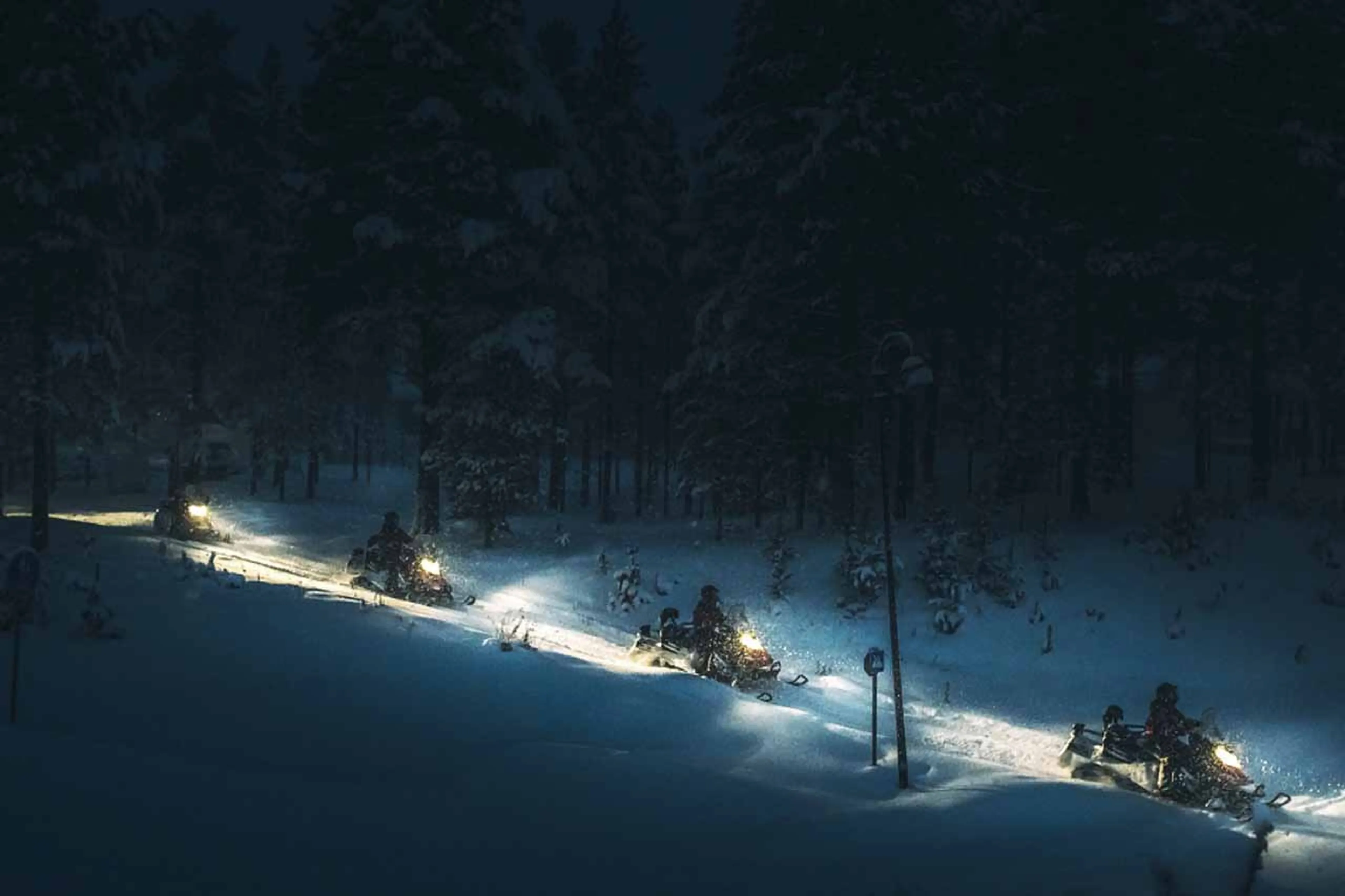 Snowmobiling at night at The Fell Lodge, Finland